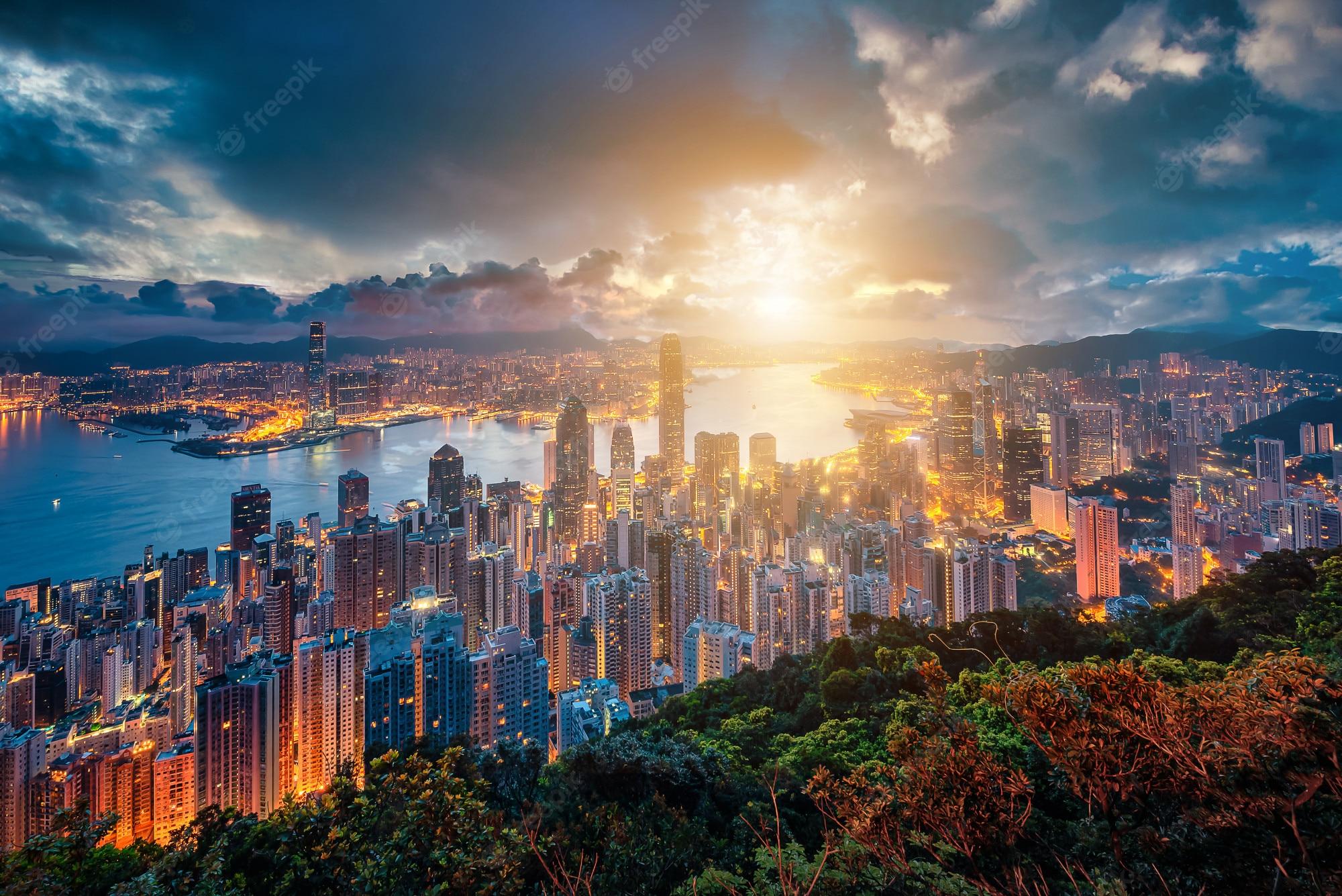 2000x1335 Premium Photo. Hong kong city skyline at sunrise view from peak mountain
