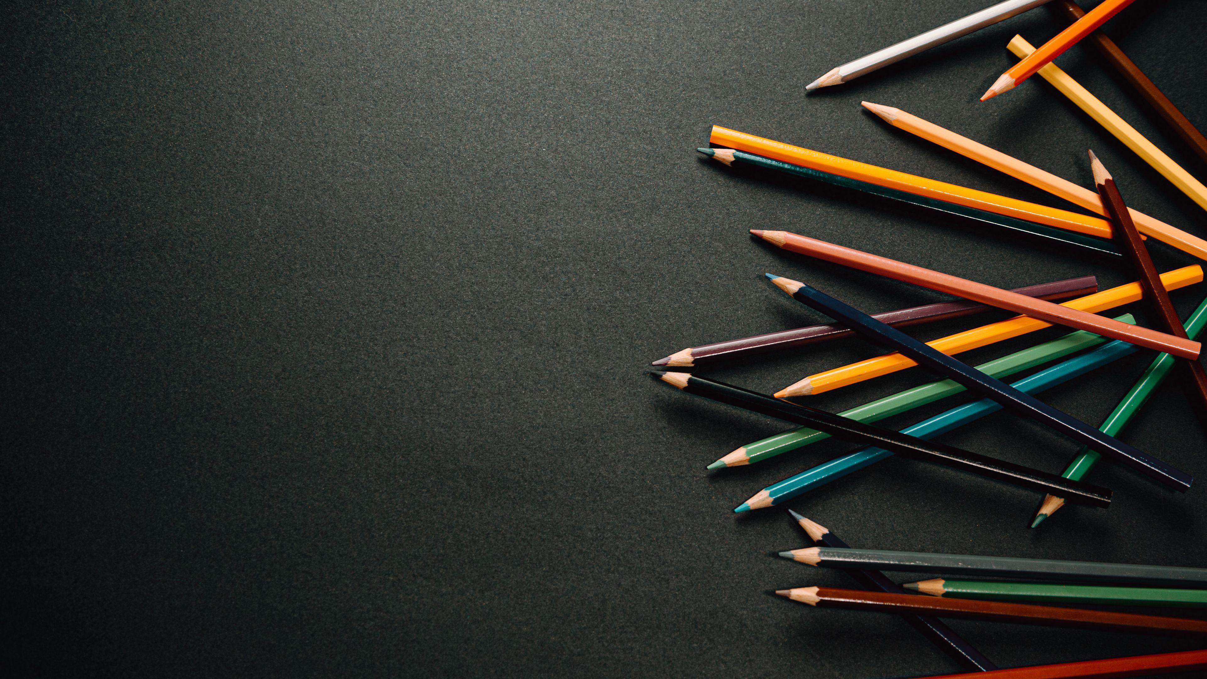 3840x2160 Download wallpaper 3840x2160 pencils, multicolored, black, surface 4k uhd 16:9 HD background