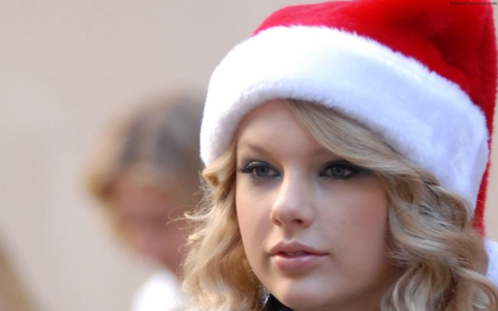 1600x1000 Taylor Swift In Christmas Cap HD Wallpaper