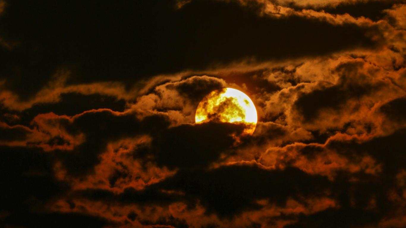 1366x768 Dark clouds sunset sun wallpaper background