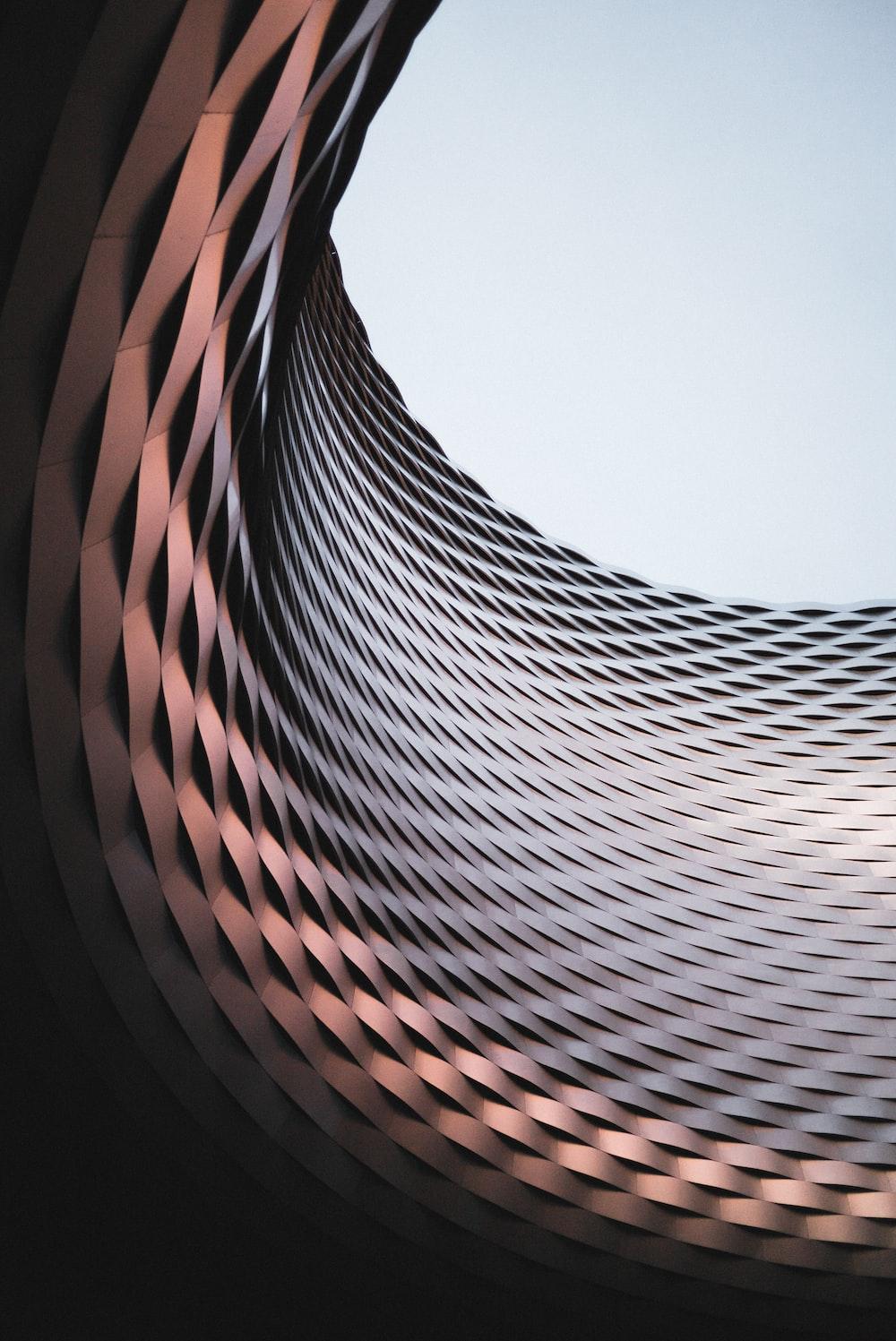 1000x1497 An abstract photo of a curved building with a blue sky in the background photo