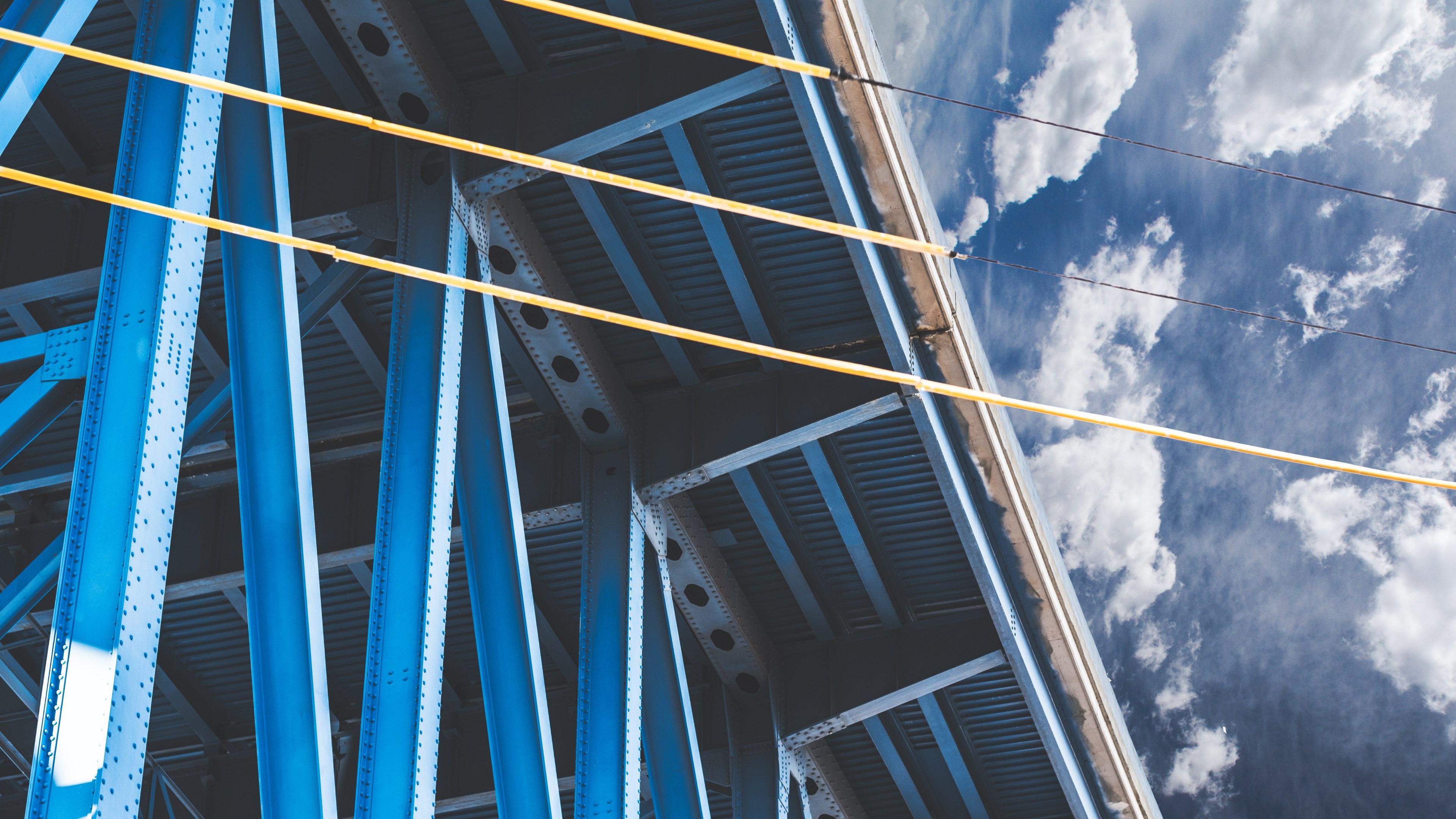 3840x2160 Wallpaper / a blue structure with yellow cables in cleveland with sky and clouds in the background, bright industrial building in cleveland 4k wallpaper free download