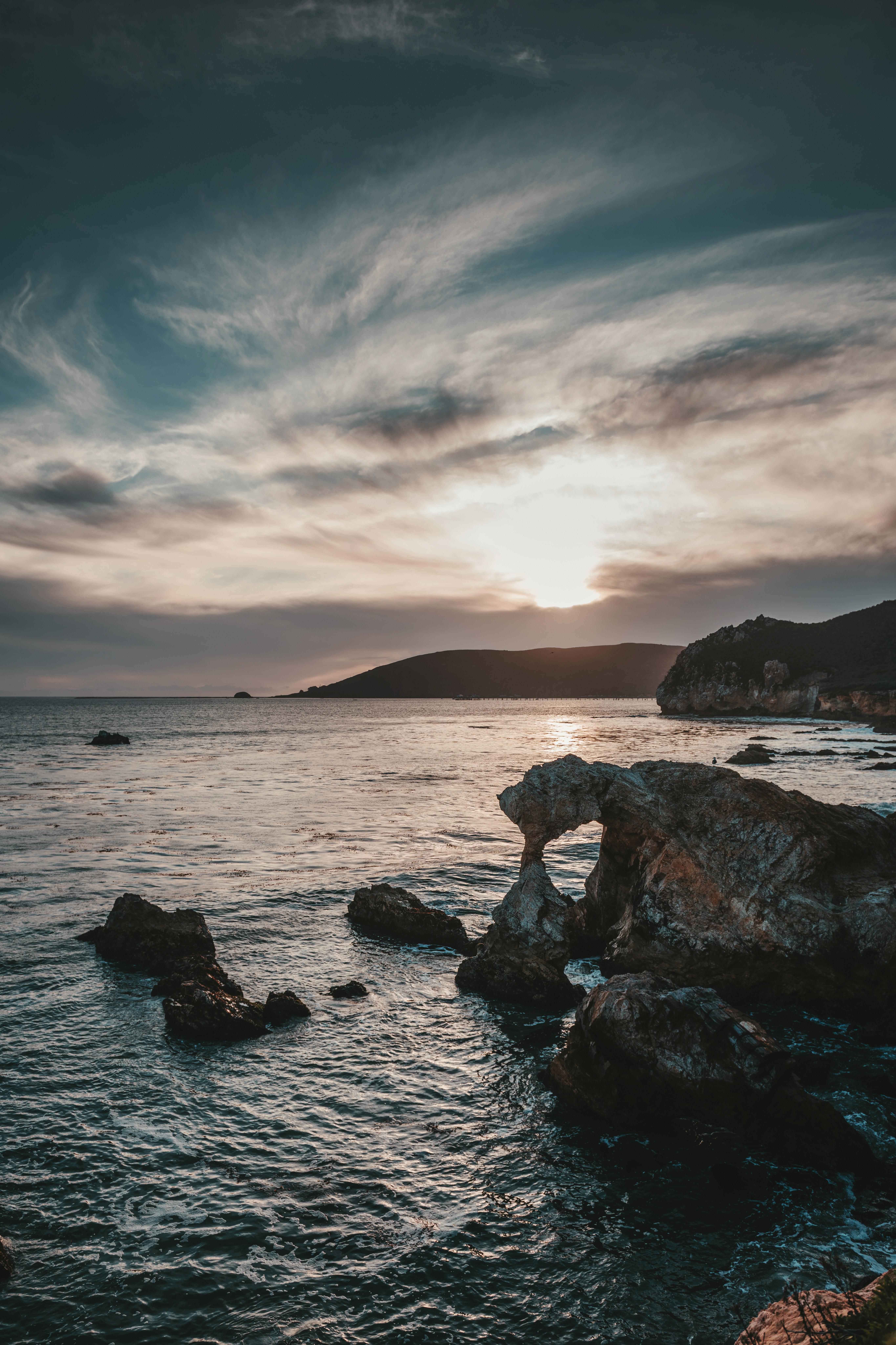 5460x8192 Light House Near Rock Formation Body of Water · Free