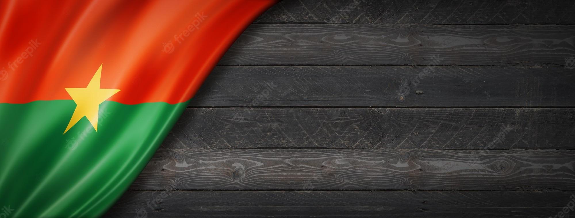 2000x758 Premium Photo. Burkina faso flag on black wood wall
