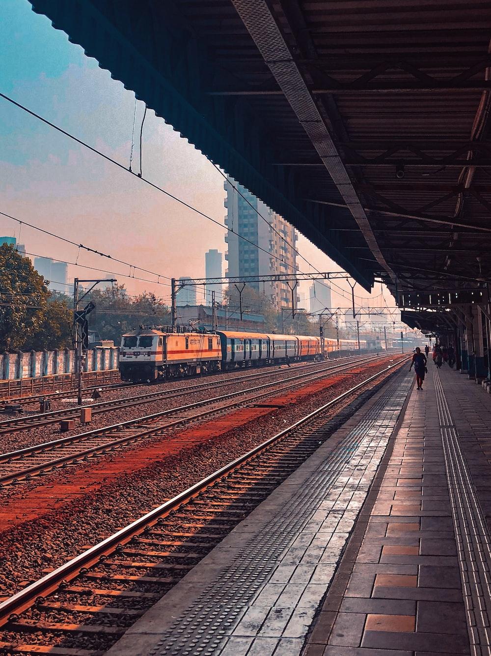 1000x1334 train on rail track during daytime photo