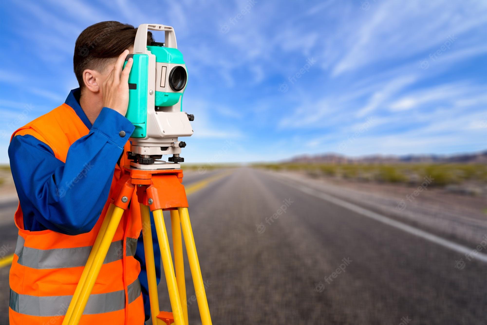 2000x1334 Premium Photo. Surveyor engineering on land on background