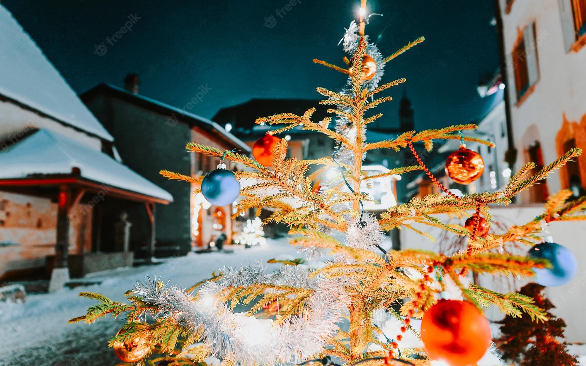 2000x1250 Premium Photo. Christmas fir tree in gruyere in fribourg during winter. switzerland at christmas. gruyeres with snow at night. castle near charmey in europe street. swiss tradition village at xmas or
