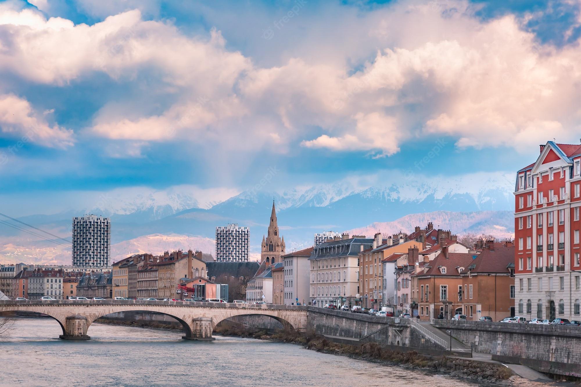 2000x1333 Premium Photo. Scenic View Of The Banks Of The Isere River And Bridge, Collegiate Church Of Saint Andre With French Alps On The Background, Grenoble, France