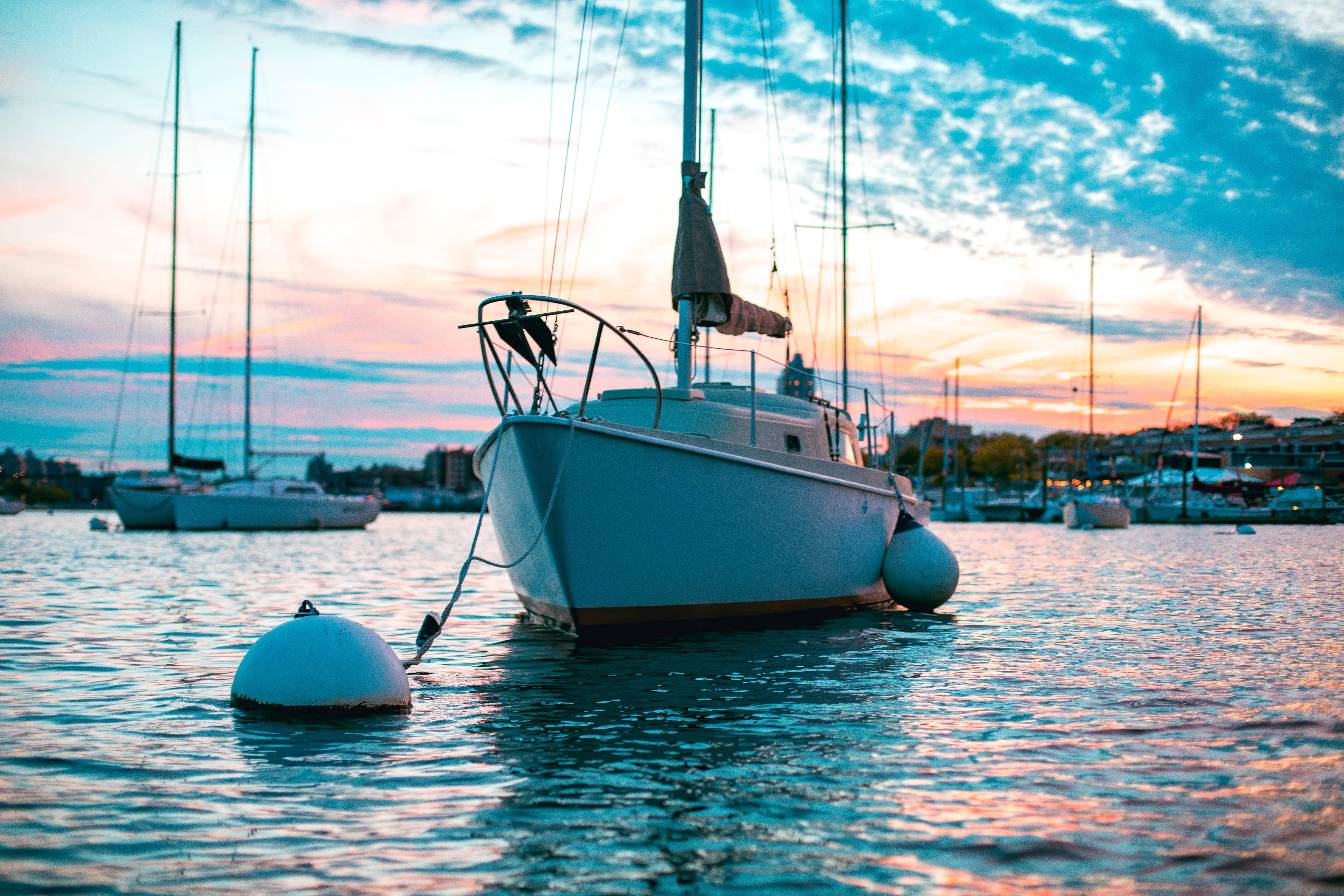 4898x3265 Download Sail Boat Attached To A Buoy Wallpaper