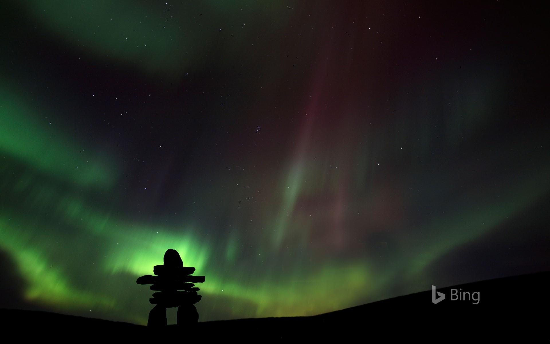 1920x1200 Inukshuk silhouetted against the northern lights in Barren Lands, Northwest Territories, Canada