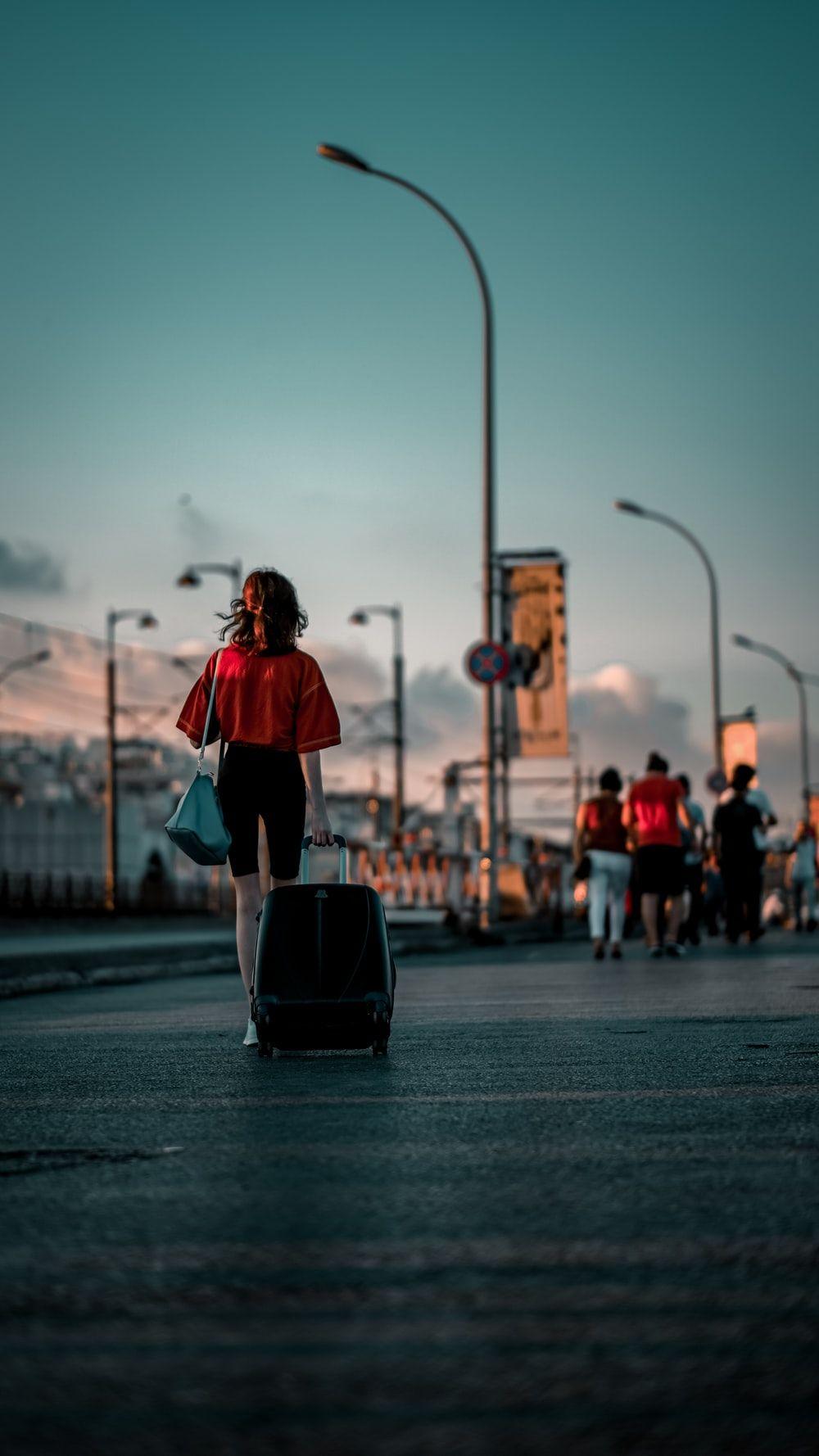 1000x1778 Women Luggage Wallpaper