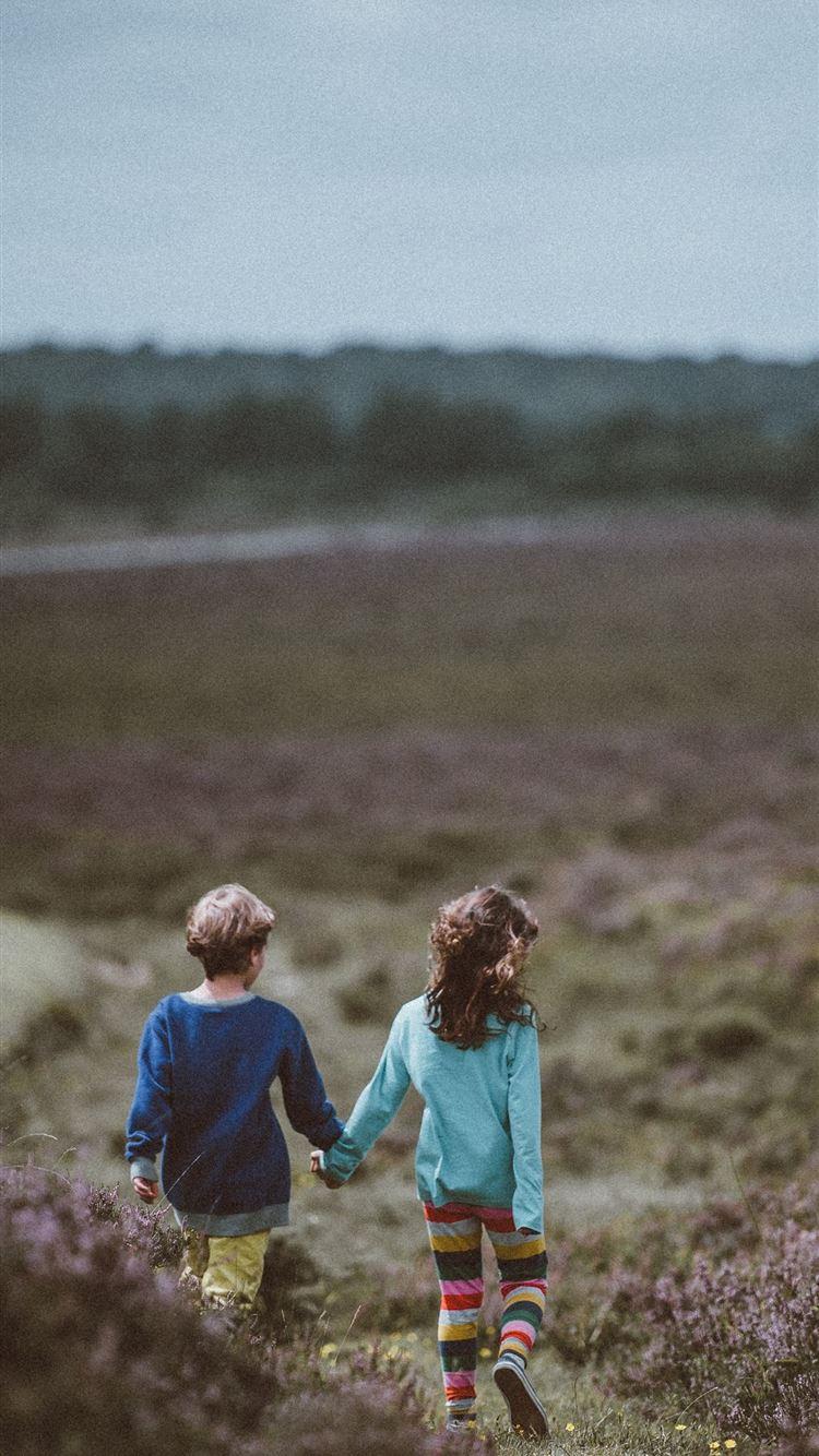 750x1334 siblings walking holding hands and background iPhone 8 Wallpaper Free Download