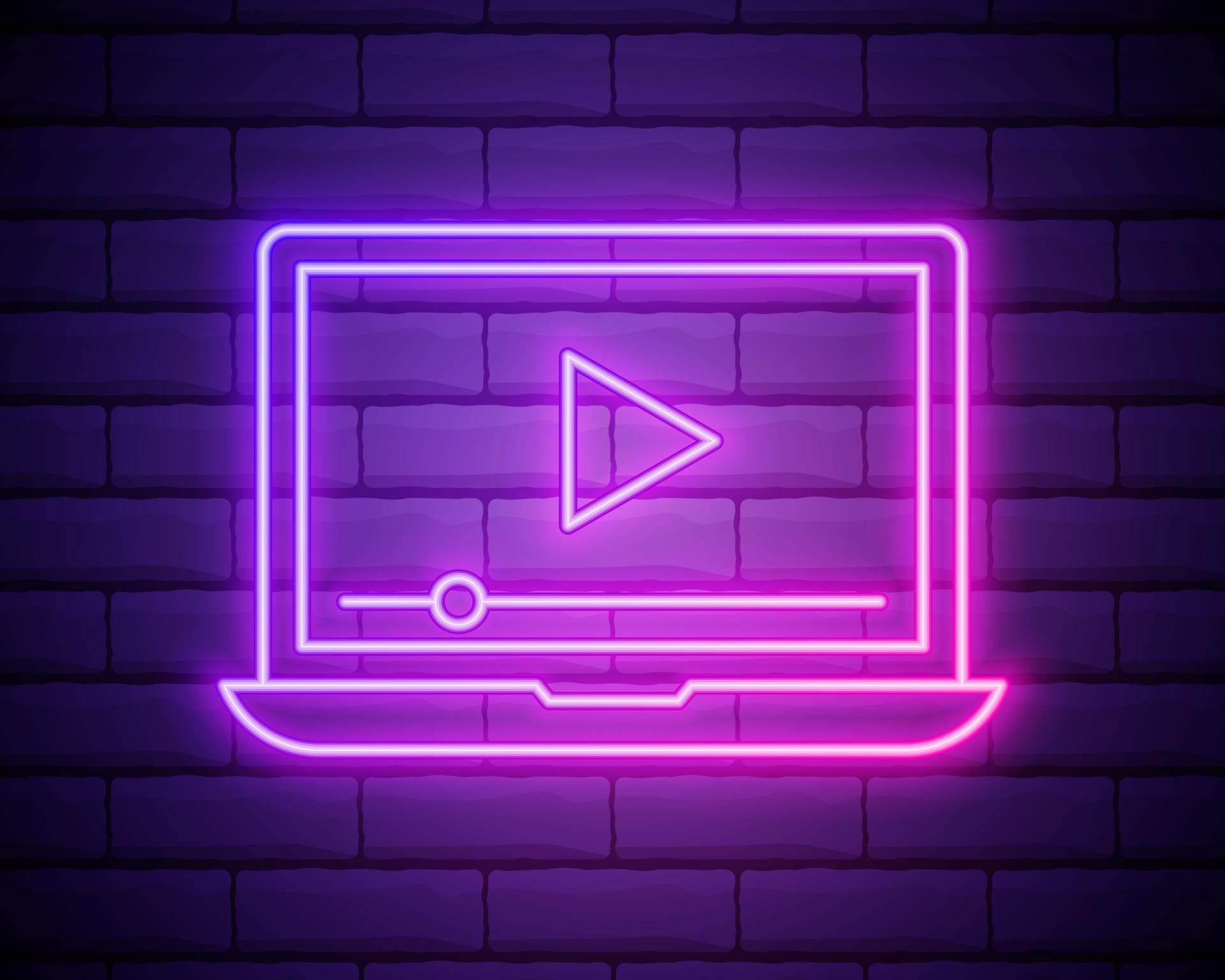 1920x1536 Glowing neon line Online play video icon isolated on brick wall background. Laptop and film strip with play sign