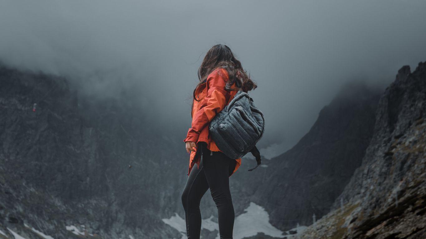 1366x768 Download wallpaper 1366x768 girl, loneliness, alone, travel, backpack, fog, rocks tablet, laptop HD background