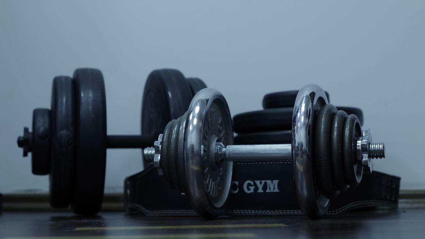 1366x768 Download wallpaper 1366x768 dumbbells, gym, weight, disks tablet, laptop HD background