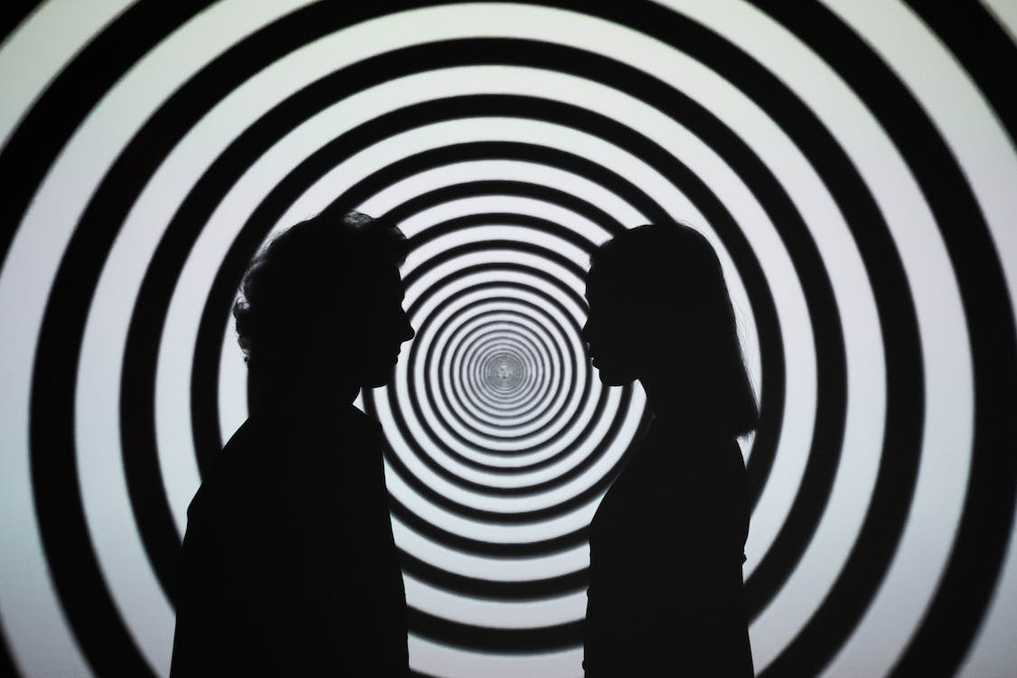 1125x750 Silhouette of 2 Person Standing in Front of White and Black Stripe Wall · Free