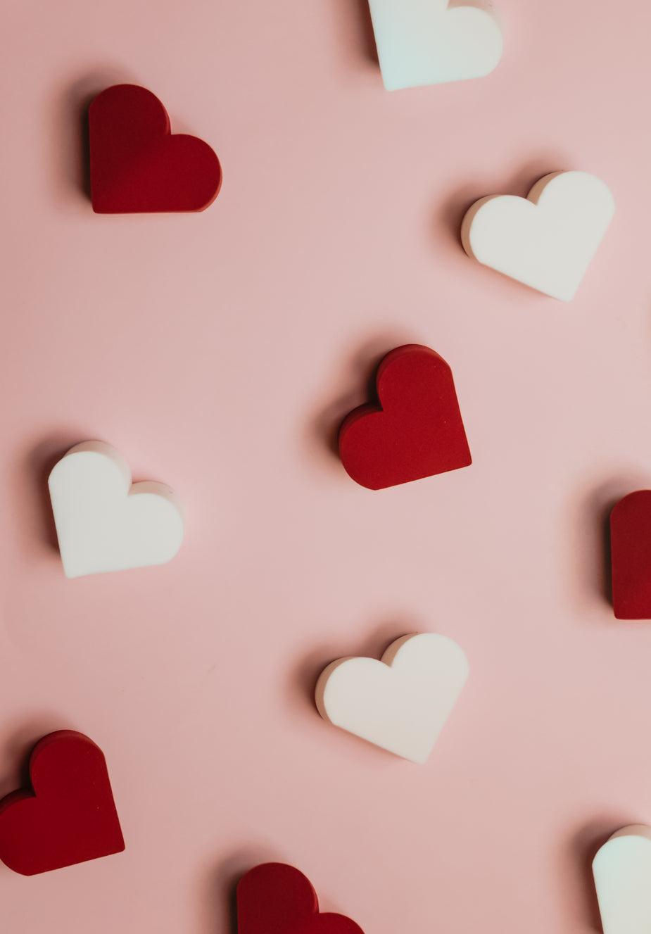 925x1327 Browse Free HD Image of Red And White Hearts Scattered On Pink Surface