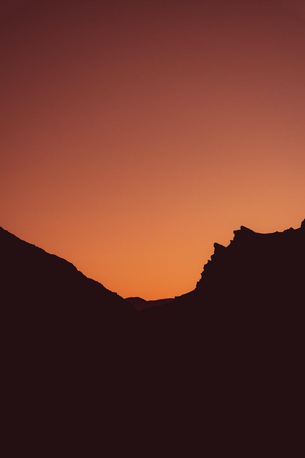 1000x1500 silhouette of mountain during sunset photo