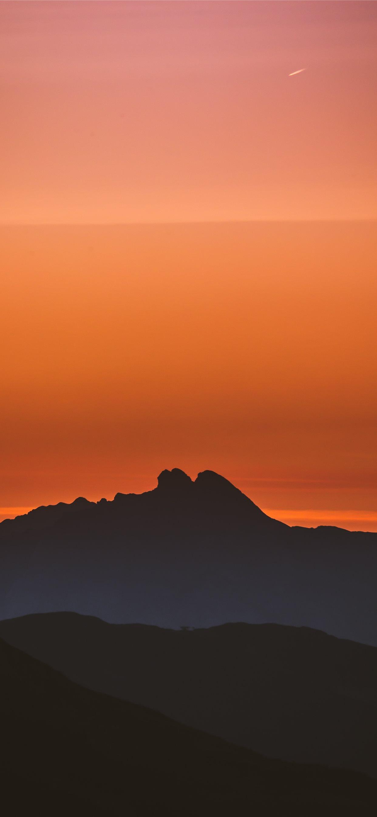 1242x2688 silhouette of mountain during golden hour iPhone X Wallpaper Free Download