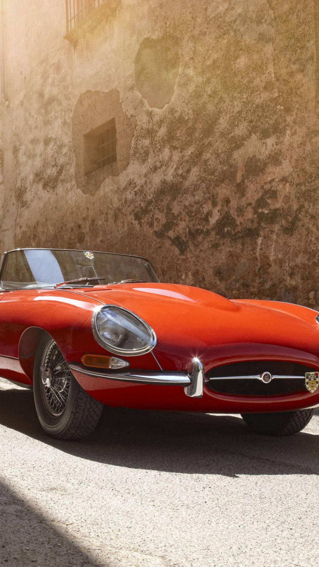 1080x1920 Download Vintage Red Convertible Jaguar Car Wallpaper
