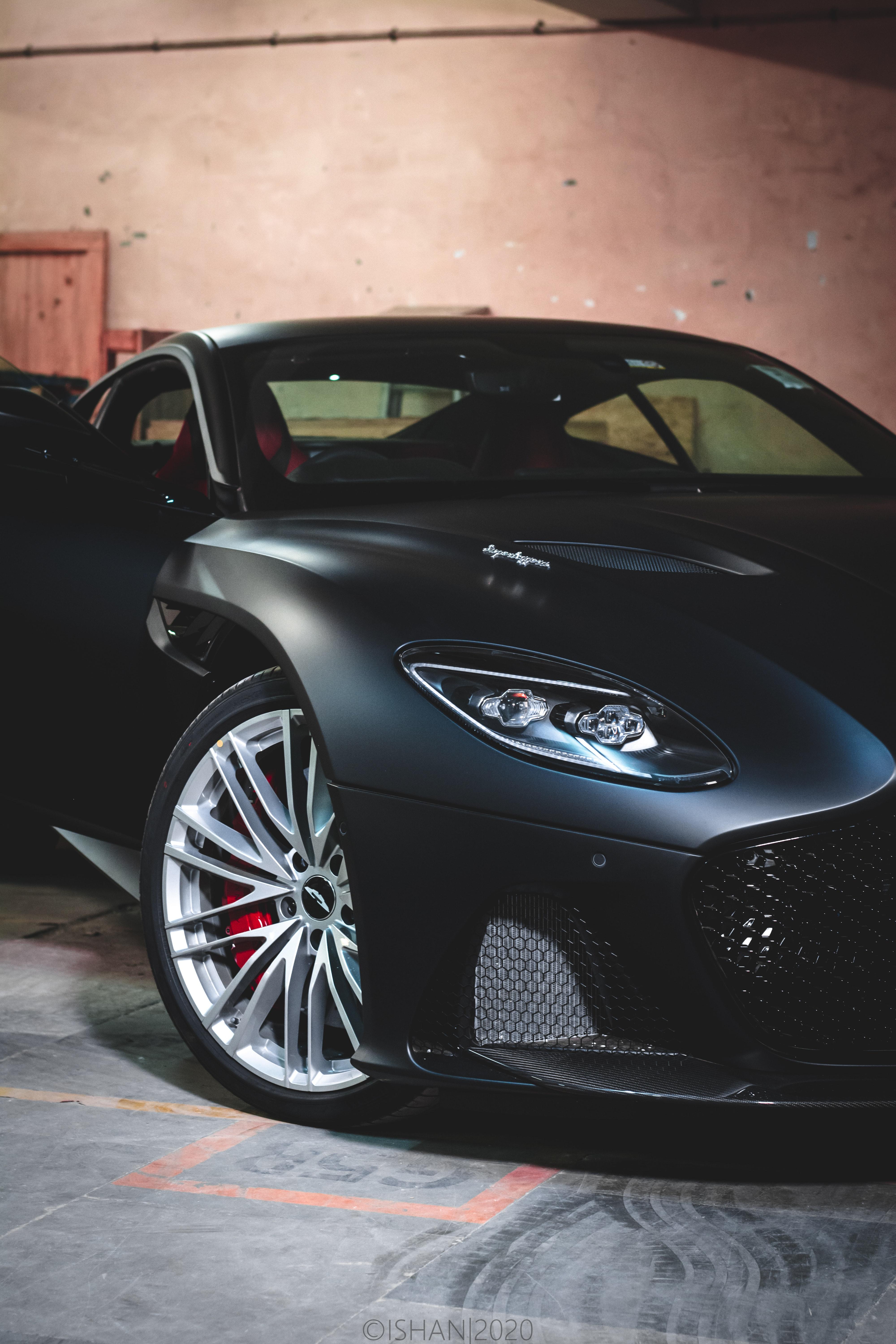 4000x6000 A Black Aston Martin Car Parked in a Garage · Free