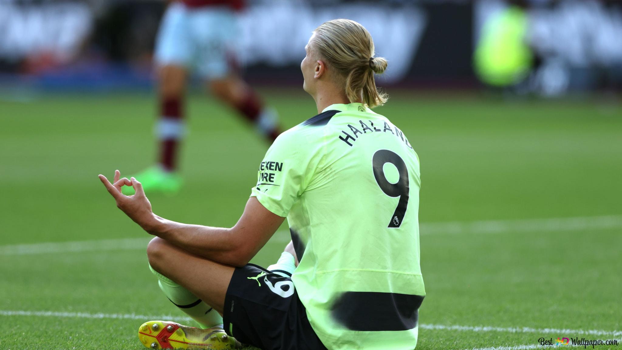 2048x1152 Manchester City striker Erling Haaland sitting in the stadium 2K wallpaper download