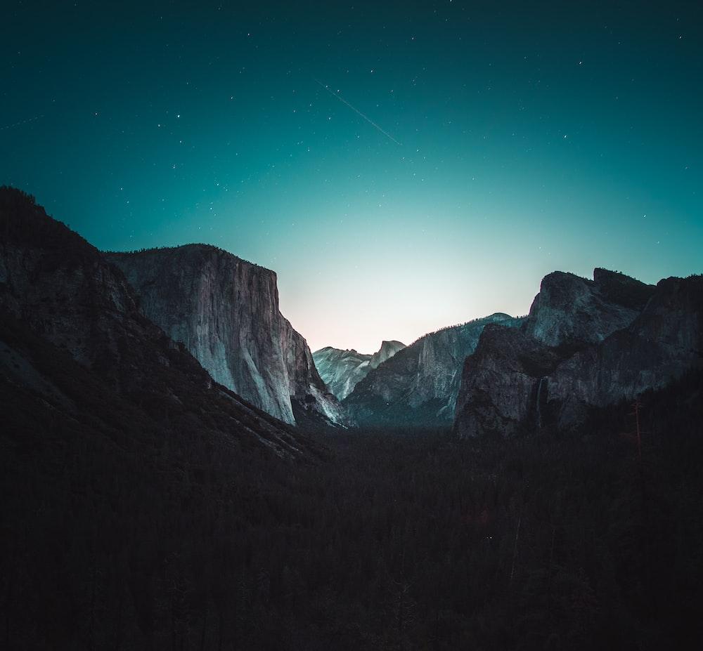 1000x927 gray and black mountain under starry sky photo