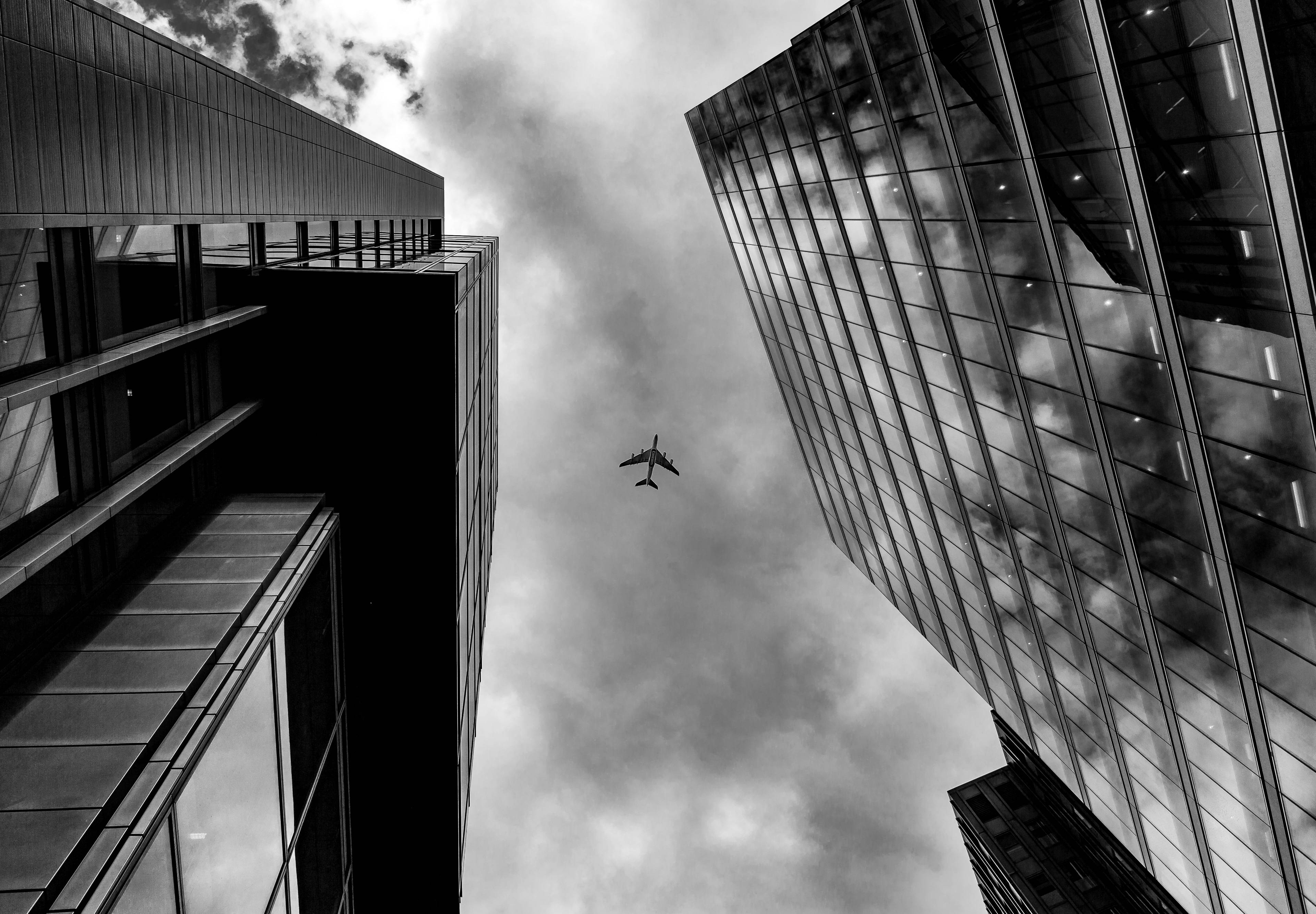 3840x2669 Plane Between Two Buildings Monochrome, HD Photography, 4k Wallpaper, Image, Background, Photo and Picture