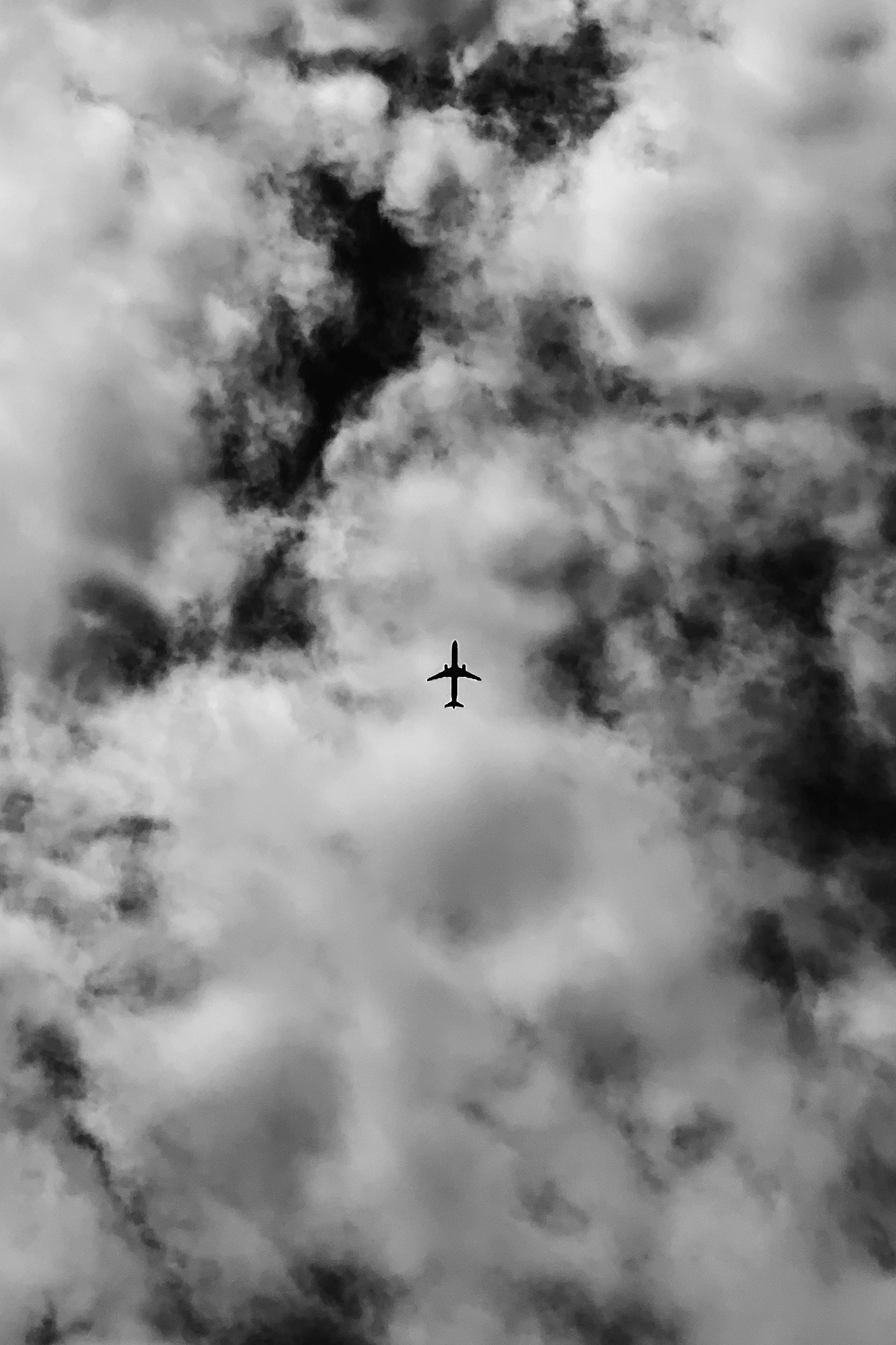 2177x3267 Grayscale Photo of an Airplane in the Sky · Free