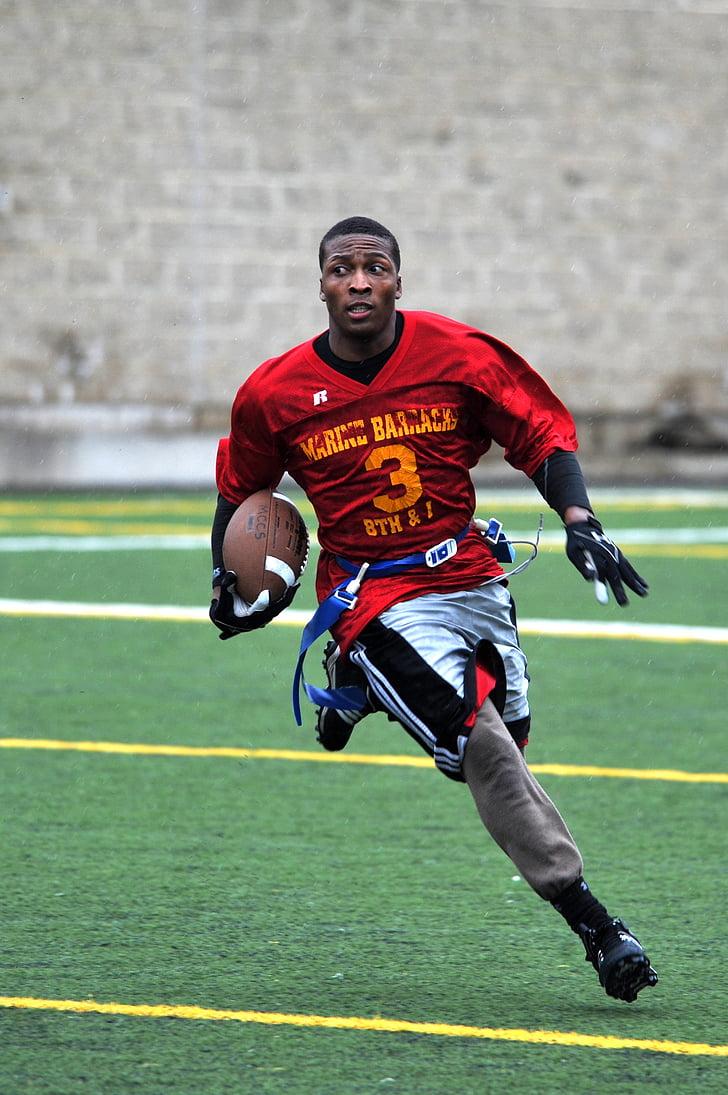 728x1095 Royalty Free Photo: Man Wearing Football Uniform Running On Green Field With Ball