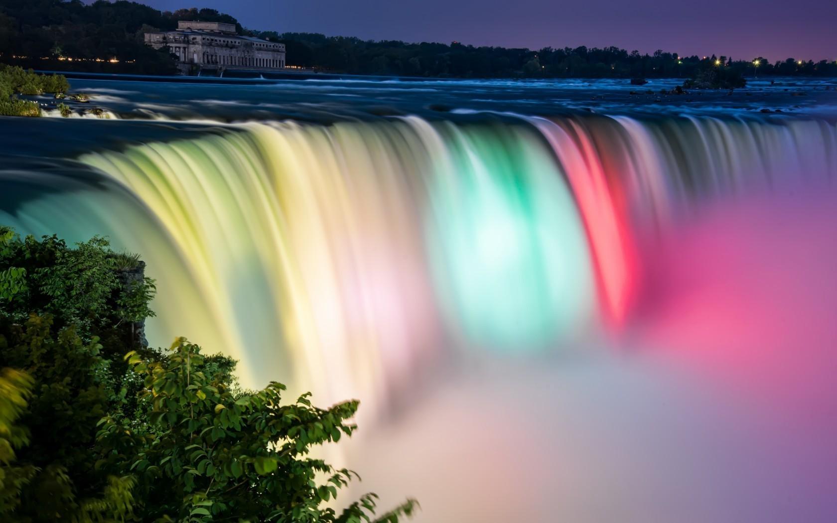 1680x1050 Illuminated waterfall near the city wallpaper