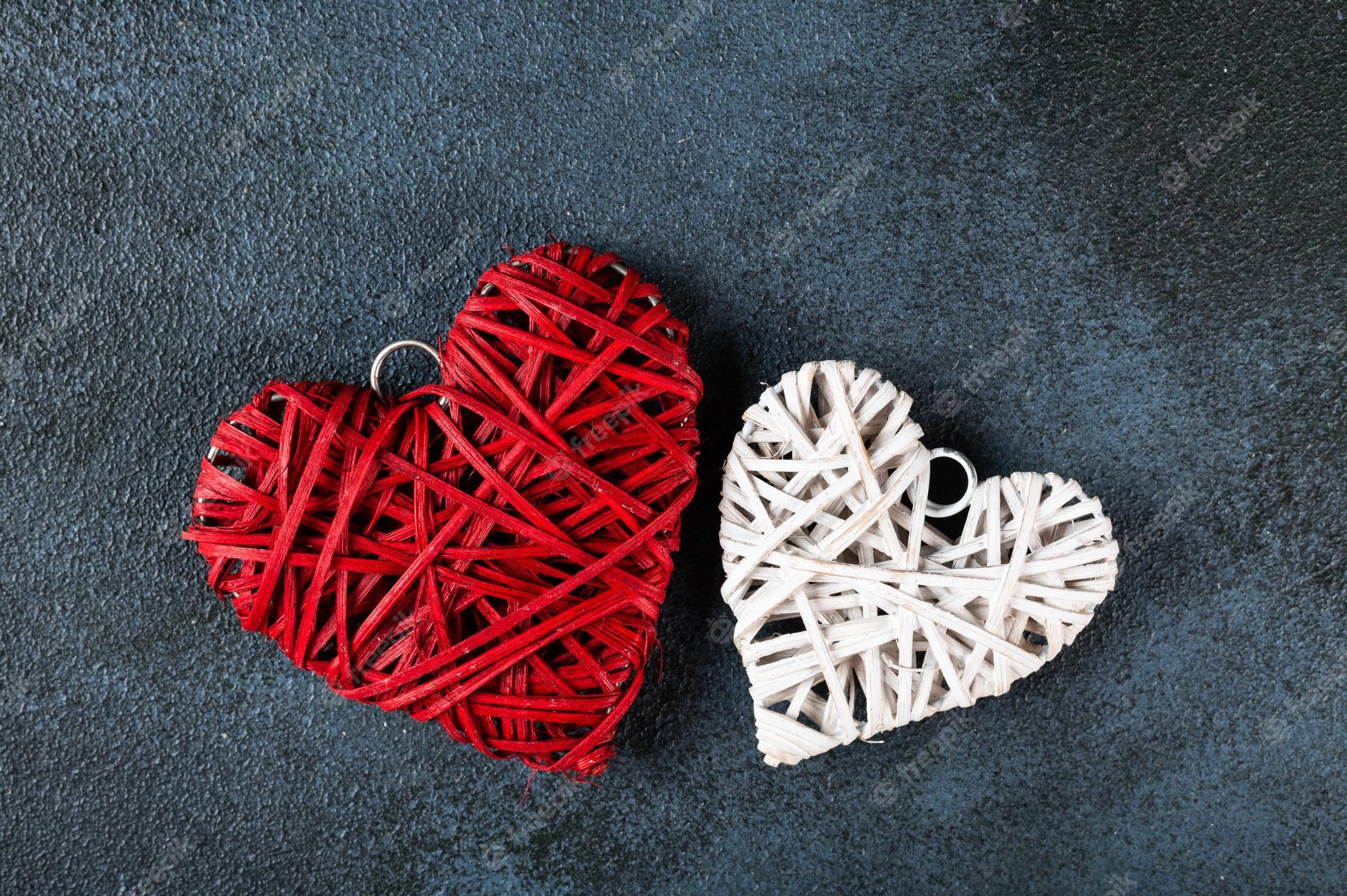 2000x1331 Premium Photo. Valentine's day background. white and red hearts on dark background. valentines day concept. flat lay, top view, copy space. mothers day flatlay. heart flatly. love