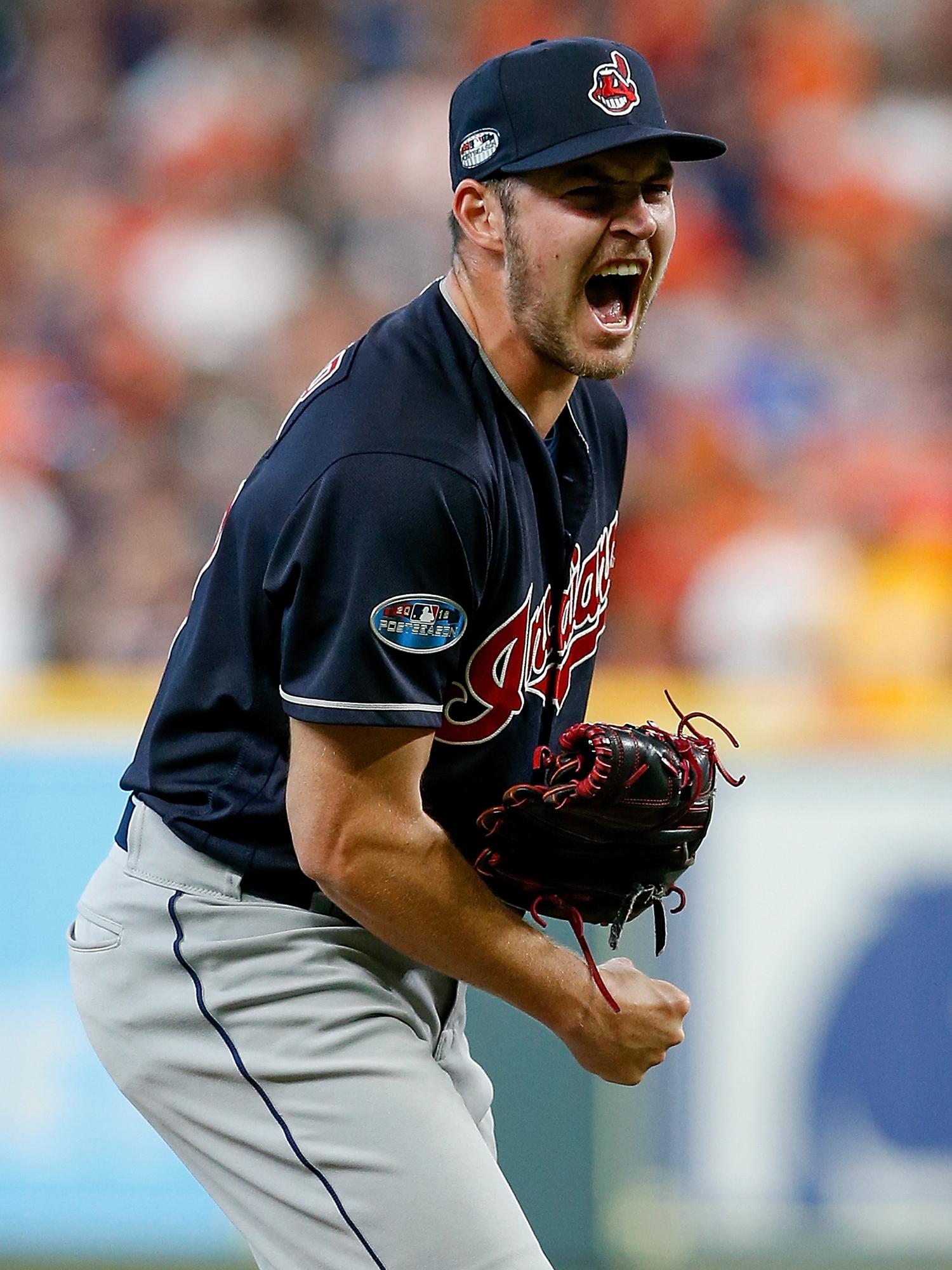 Download Trevor Bauer Crouching During A Game Wallpaper