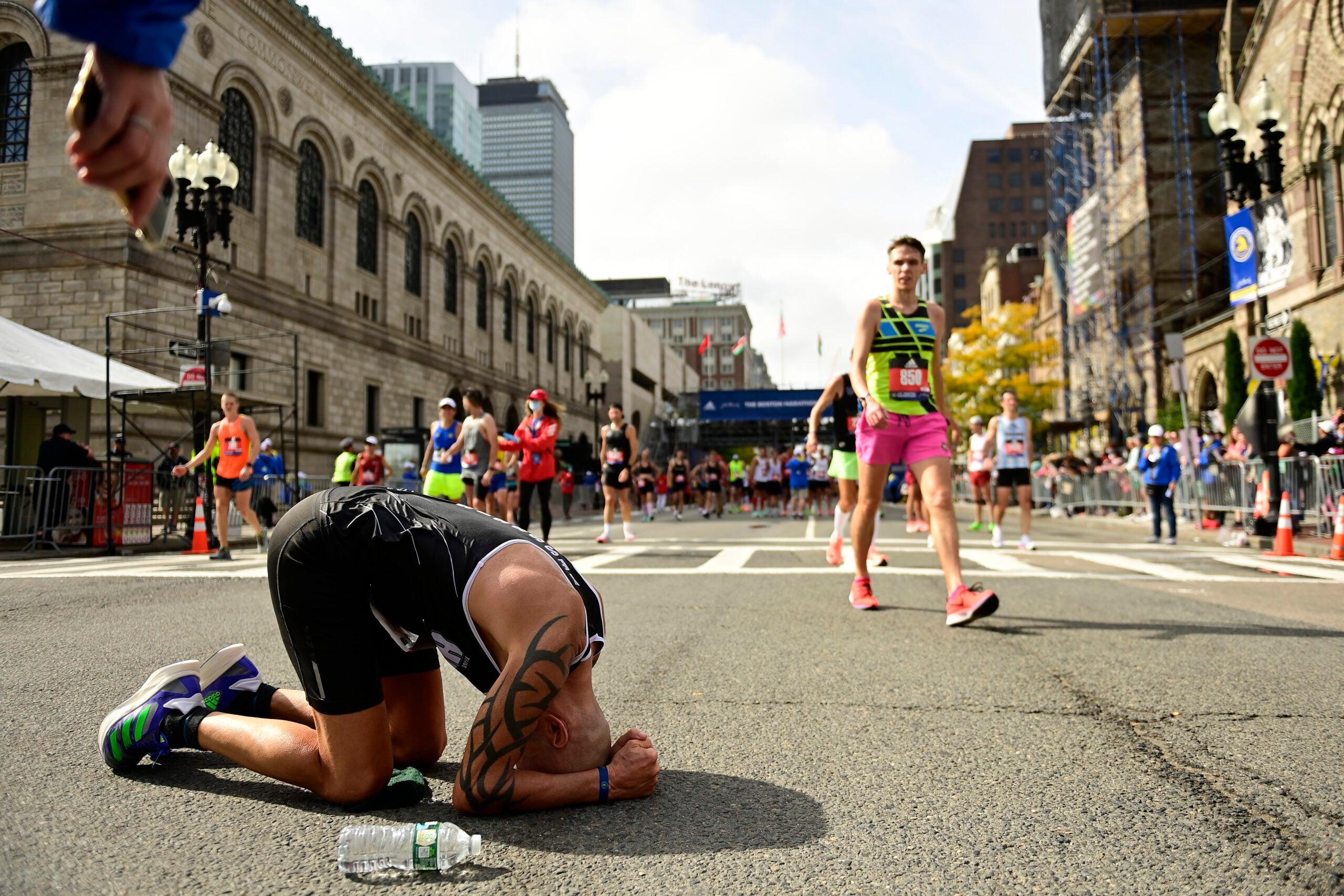 2560x1706 photo showing the pure joy and utter exhaustion at the 2021 Boston Marathon finish line