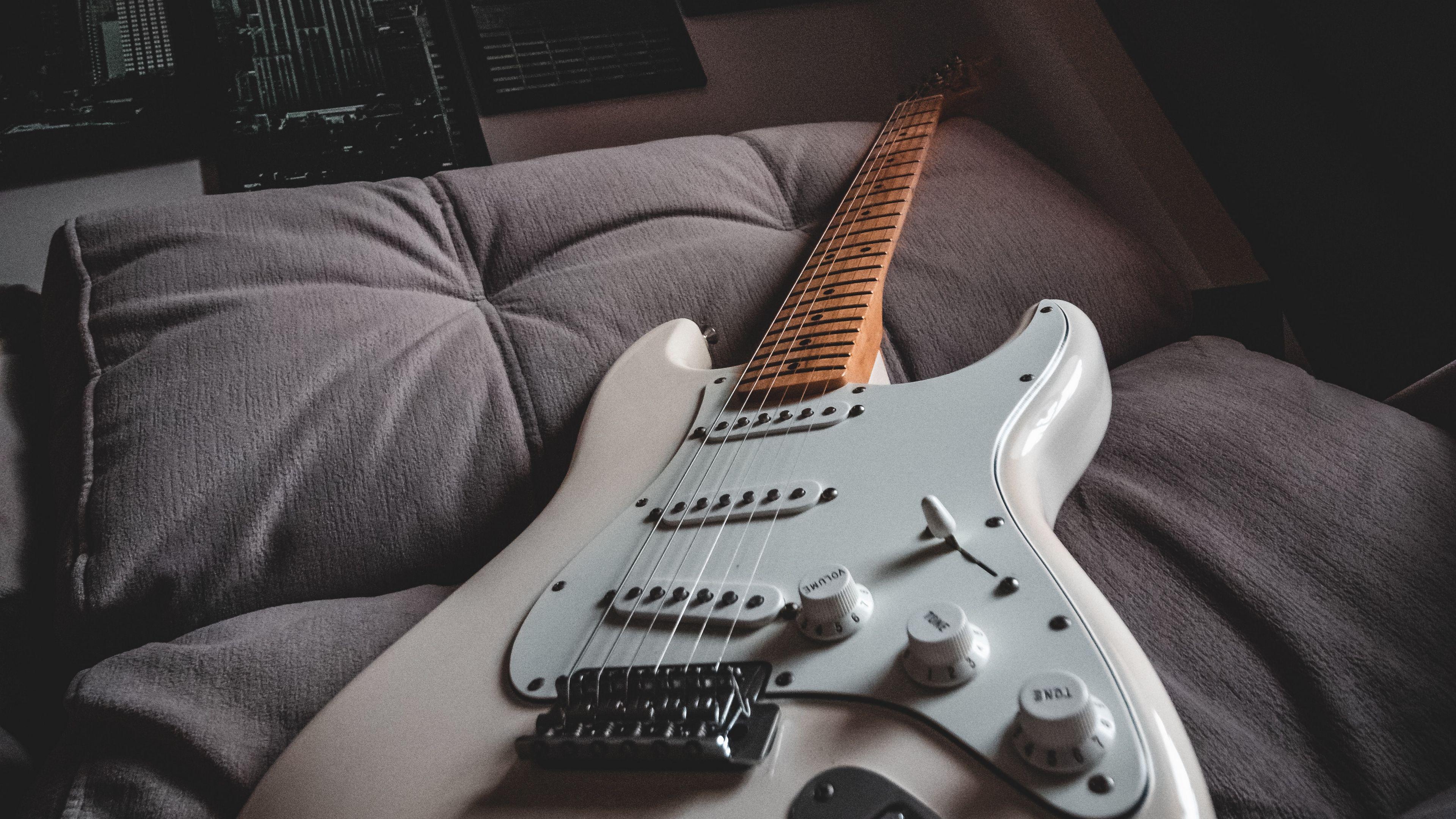 3840x2160 Download wallpaper 3840x2160 electric guitar, guitar, white, musical instrument, music 4k uhd 16:9 HD background