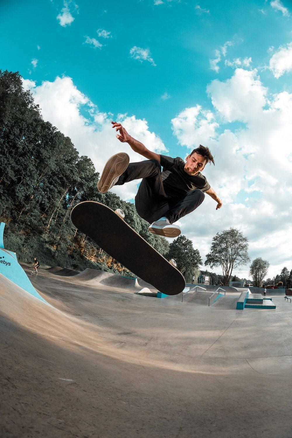 1000x1500 Download Aesthetic Skateboard Blue Sky Wallpaper