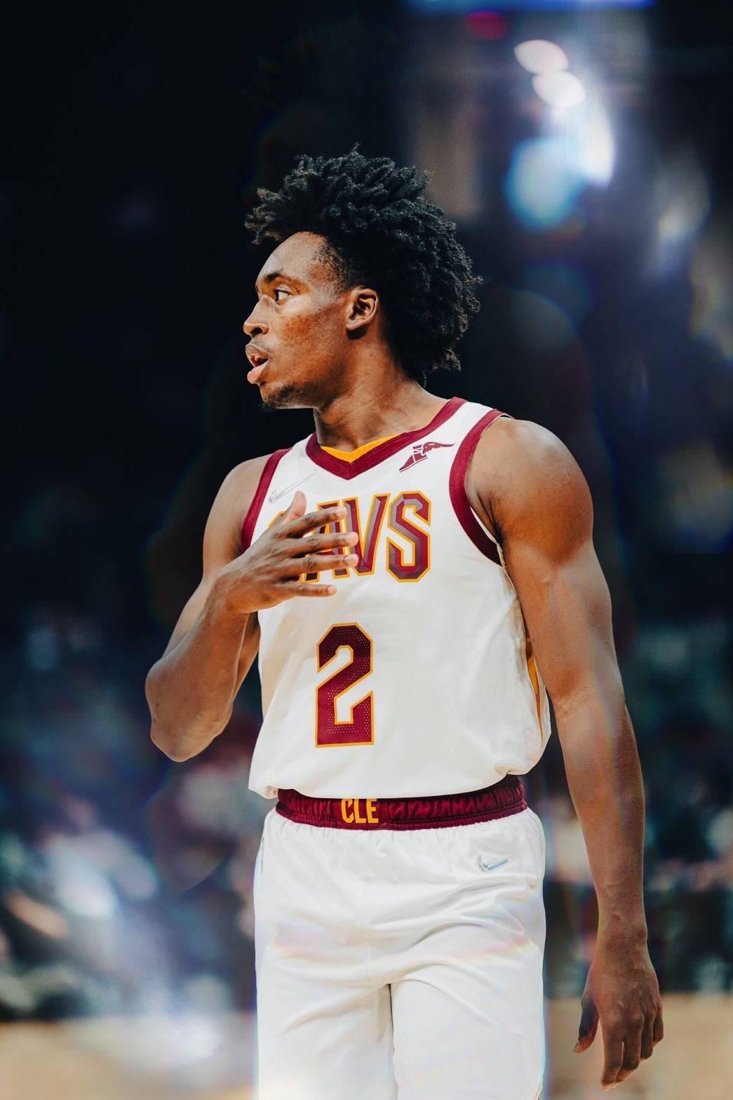 1045x1567 Download Basketball League Collin Sexton Facing Other Side Wallpaper