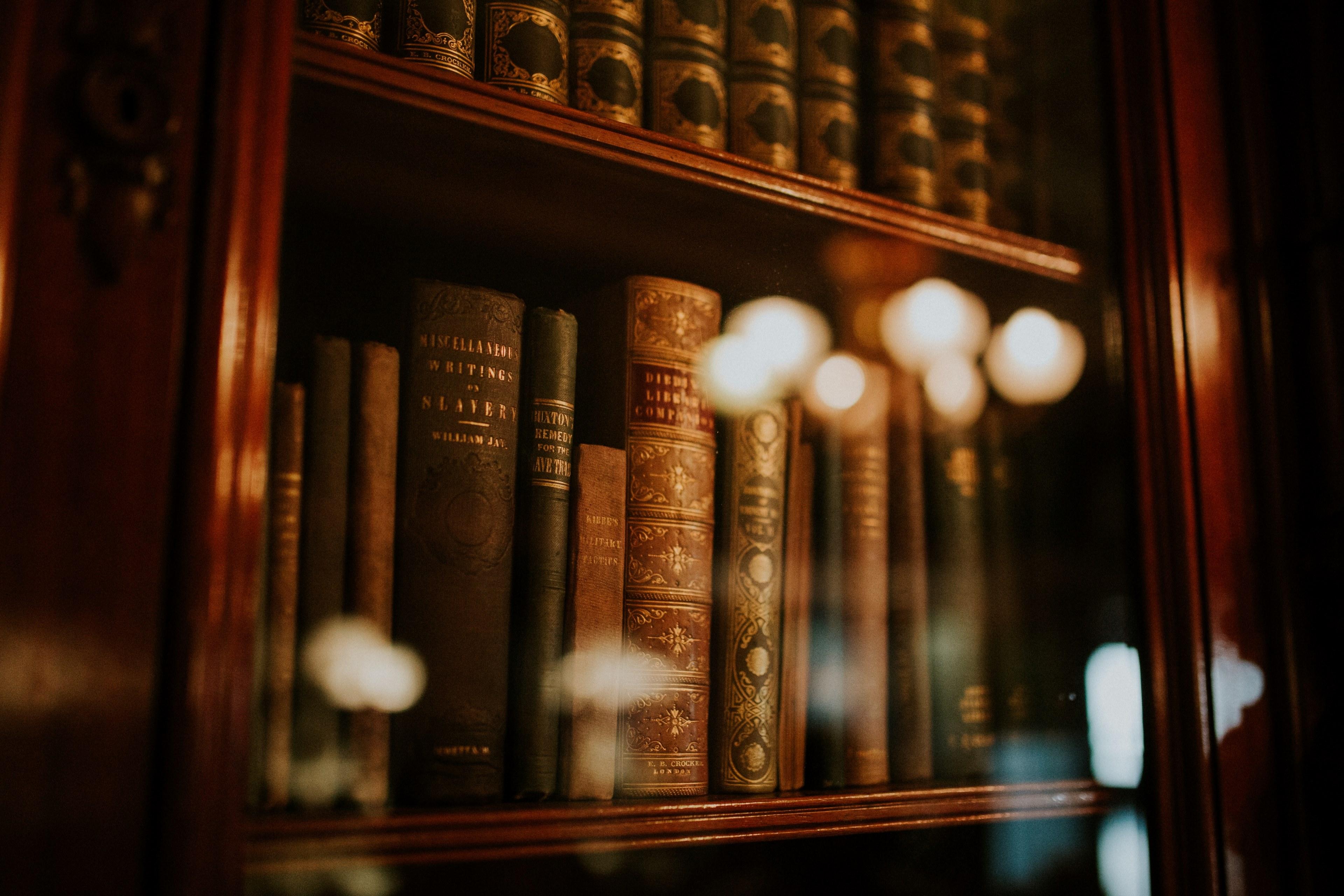 3840x2560 Wallpaper / a bookcase containing old books with a glass door in the library, book case of old books_ 4k wallpaper free download