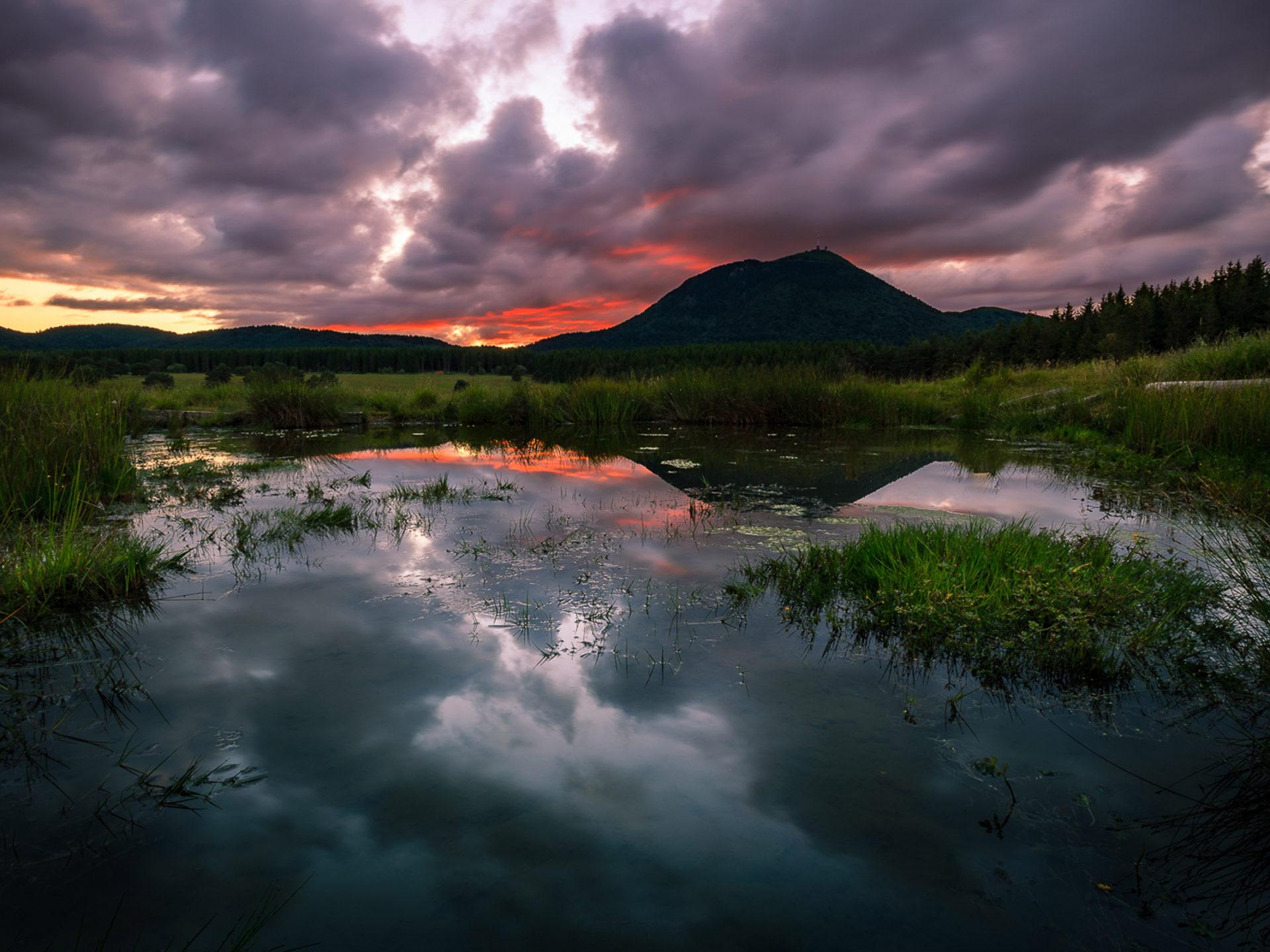 1920x1440 Sunset Sky With Dark Black Clouds Behind The Most Famous Volcano Of Auvergne, France Desktop Wallpaper HD 2560x1600 :