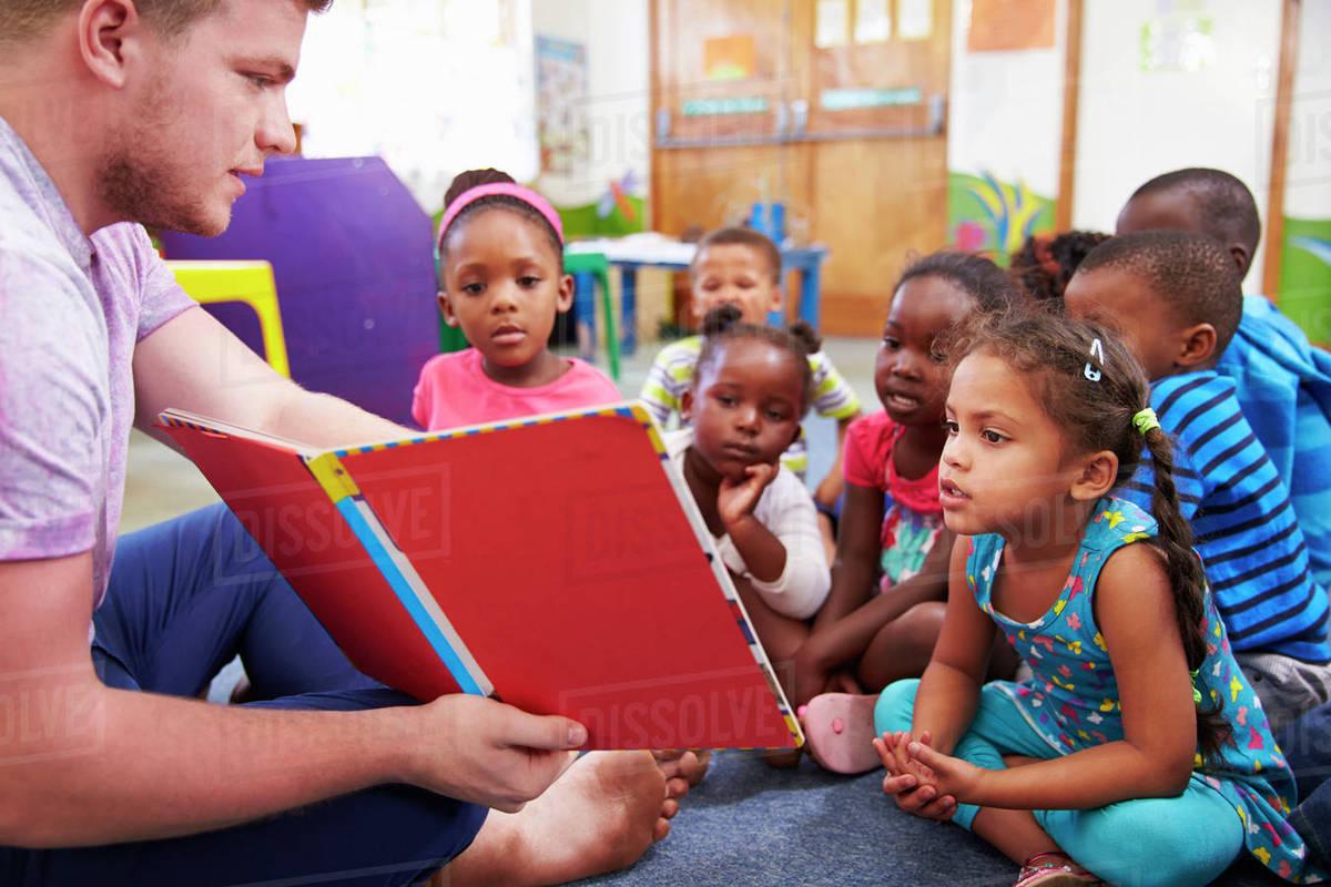 1200x800 Volunteer teacher reading to a class of preschool kids