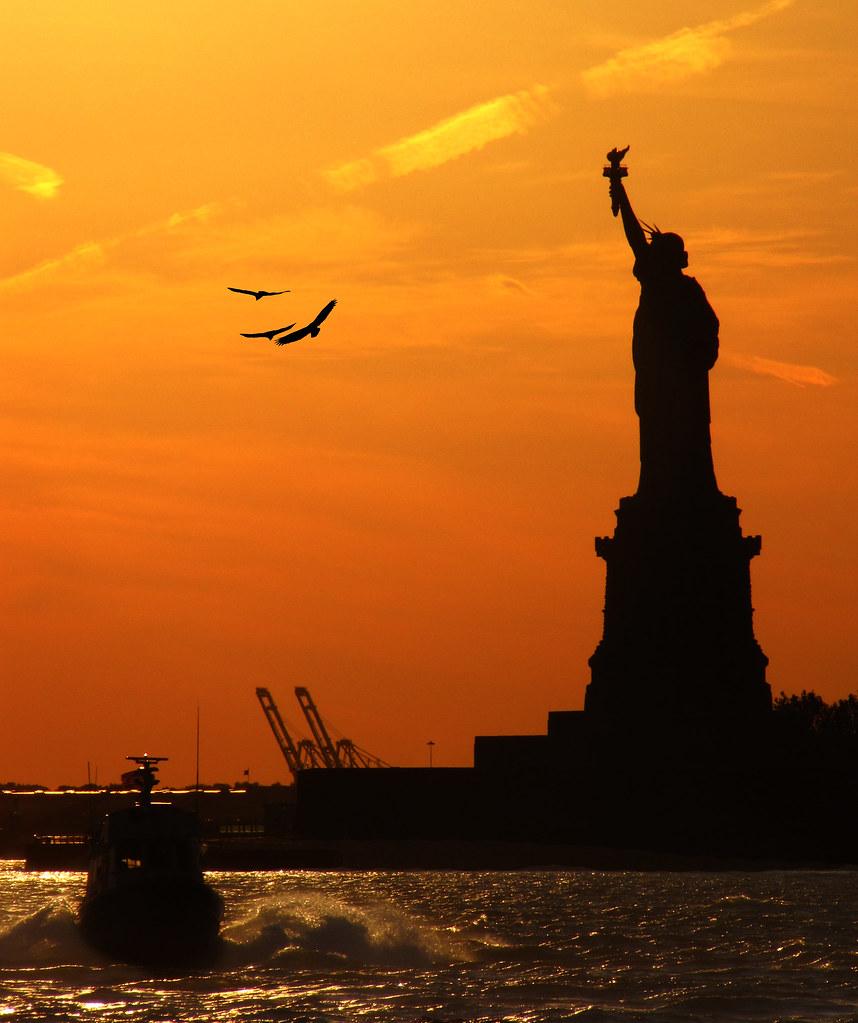 858x1023 Statue of Liberty during Sunset. Sunset behind the Statue o