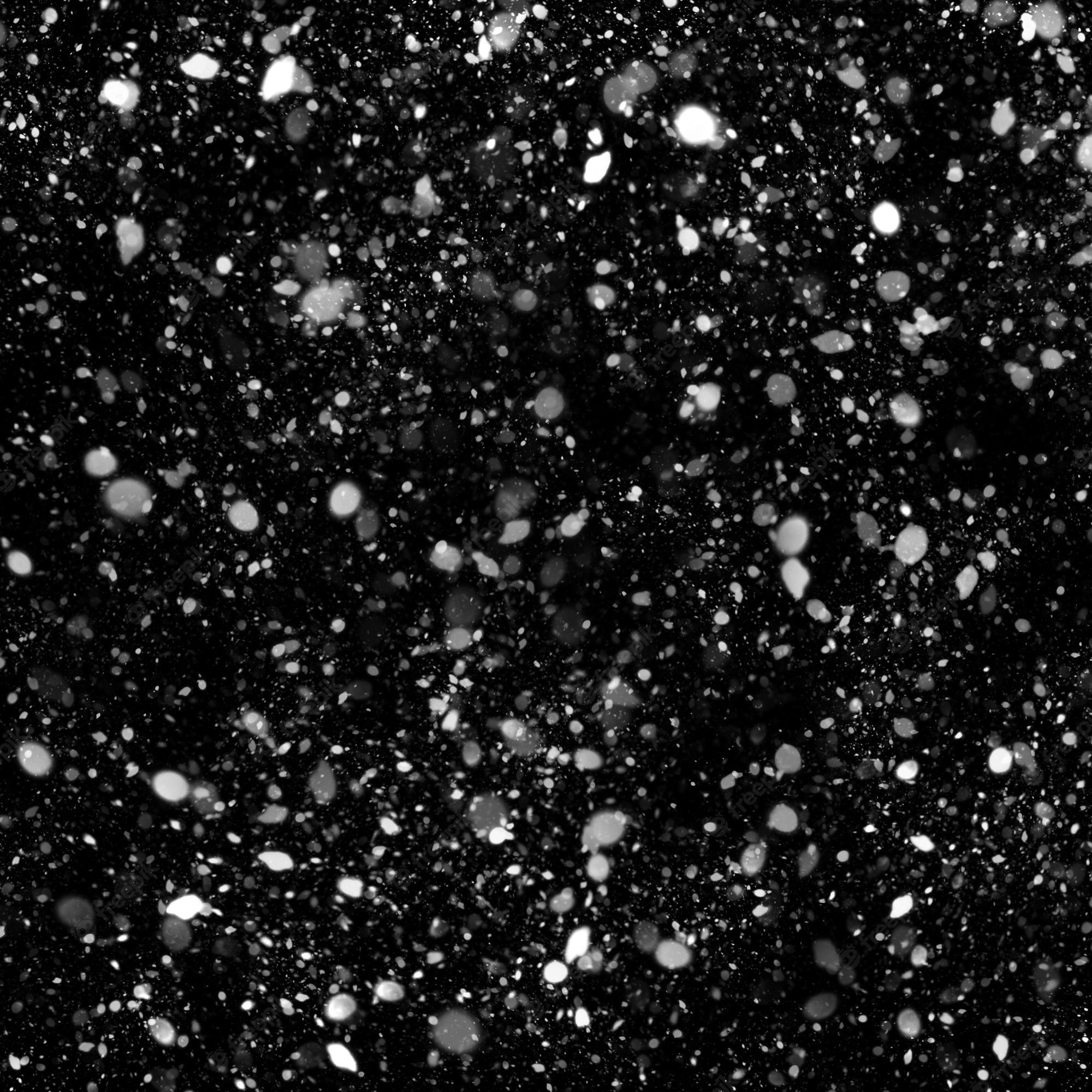 2000x2000 Premium Photo. Isolated natural white snow texture effect on black night background