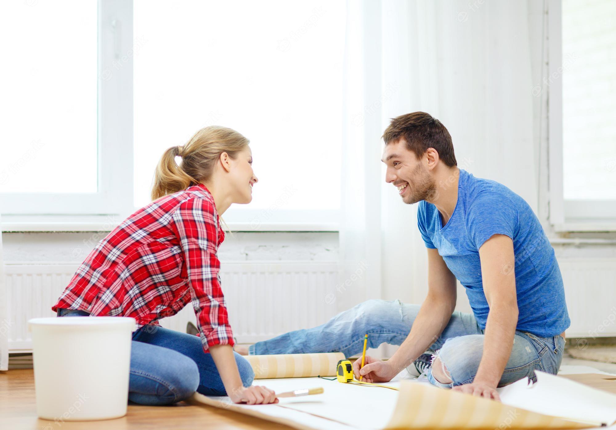 2000x1395 Premium Photo. Repair, building and home concept couple measuring wallpaper