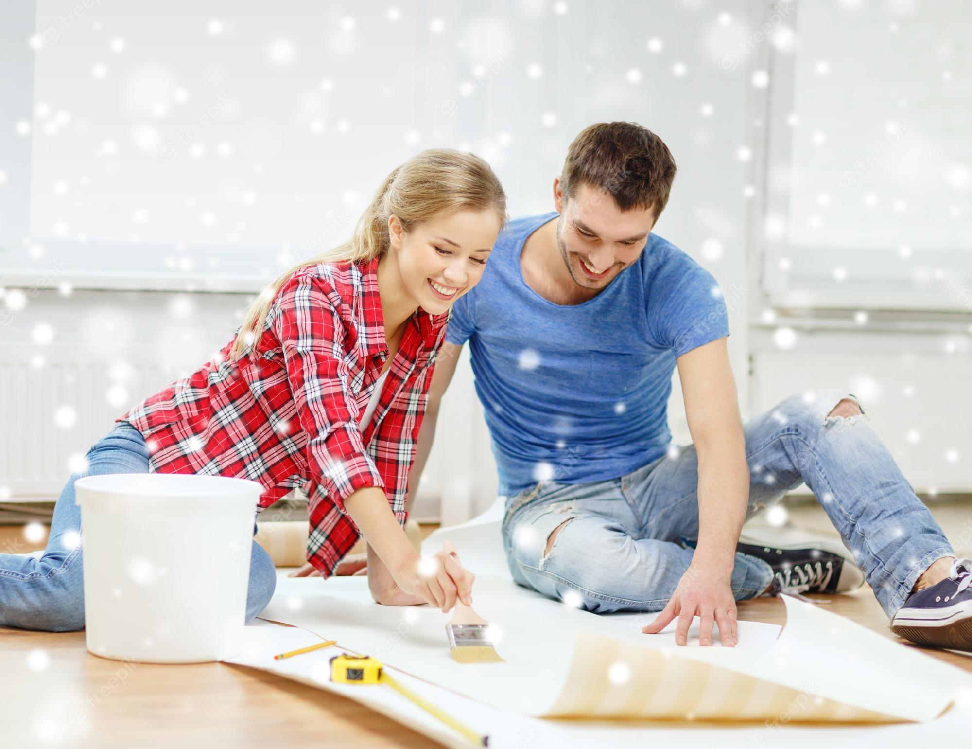 2000x1540 Premium Photo. Repair, building, teamwork and home concept couple smearing wallpaper with glue