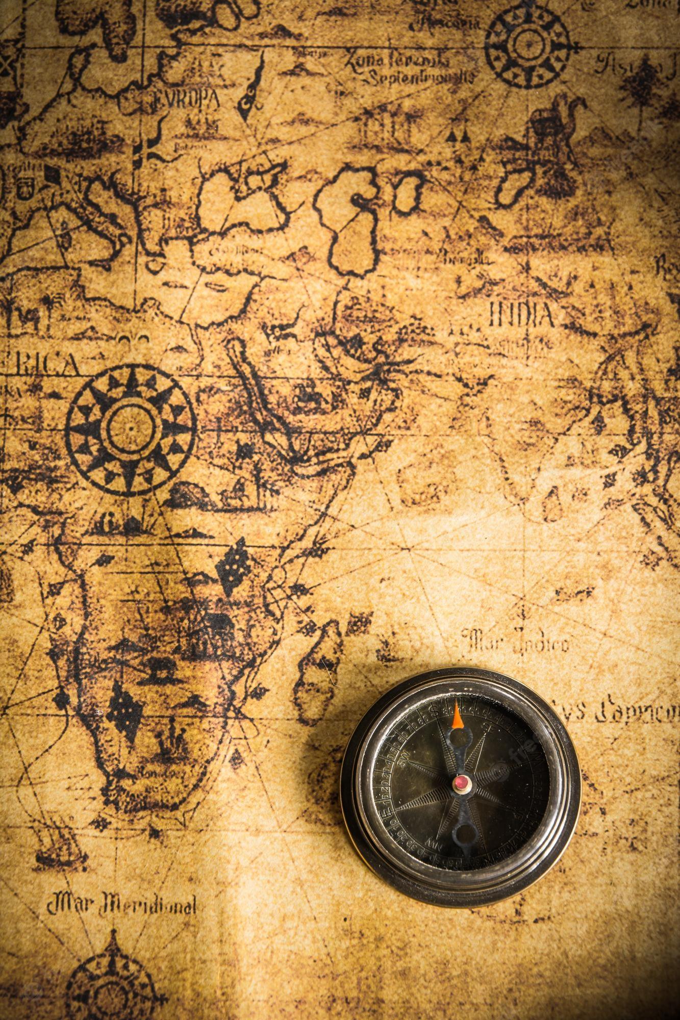 1333x2000 Premium Photo. Old vintage retro compass on ancient mapthe map used for background is in public domain