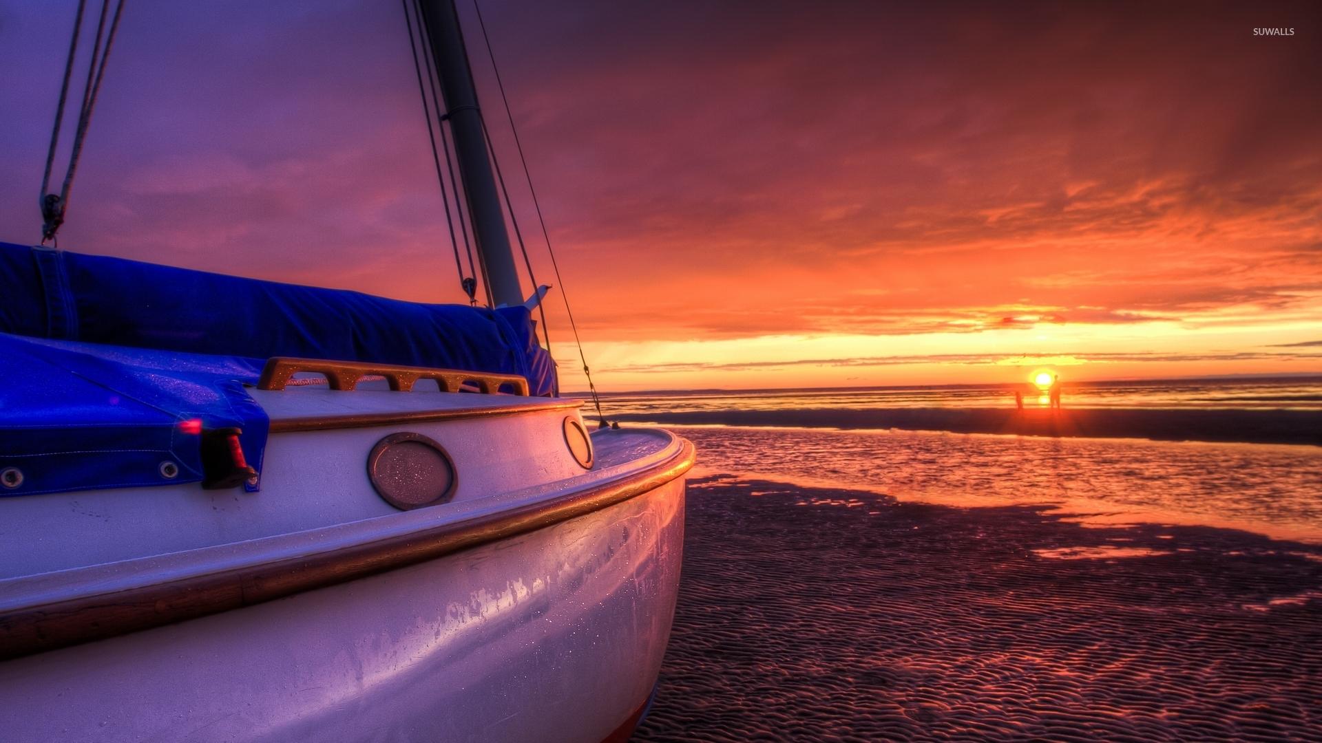 1920x1080 Sailing boat on a sunset beach wallpaper wallpaper