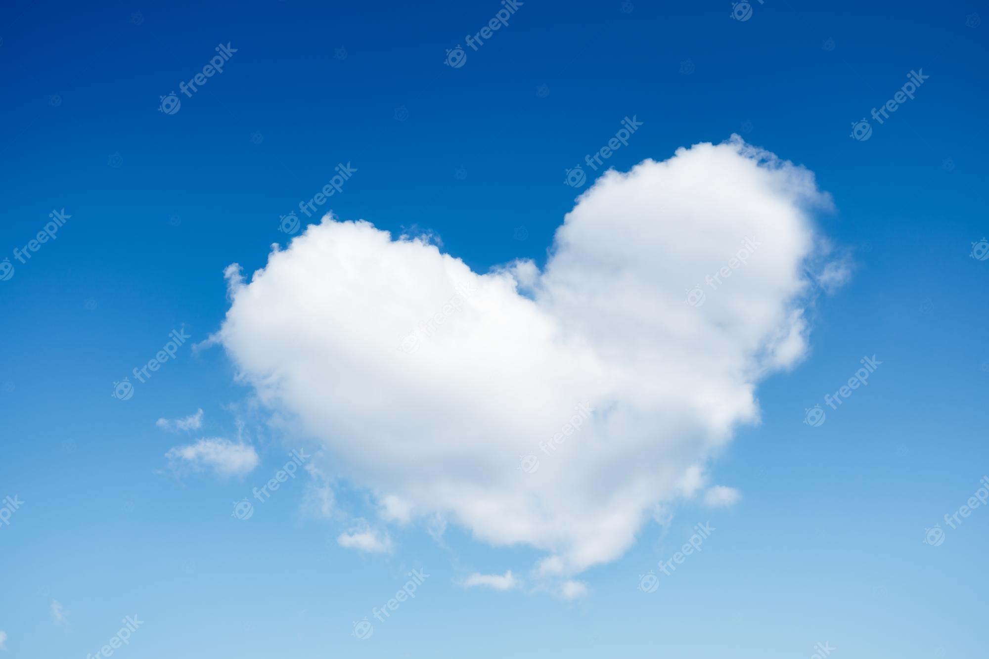 2000x1333 Premium Photo. A cloud in the shape of a heart a blue sky and a heart sign romance and love high resolution photo as wallpaper