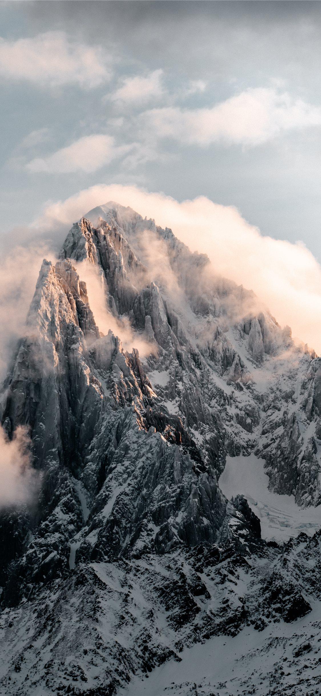 1125x2436 snow covered mountain during daytime iPhone 11 Wallpaper Free Download