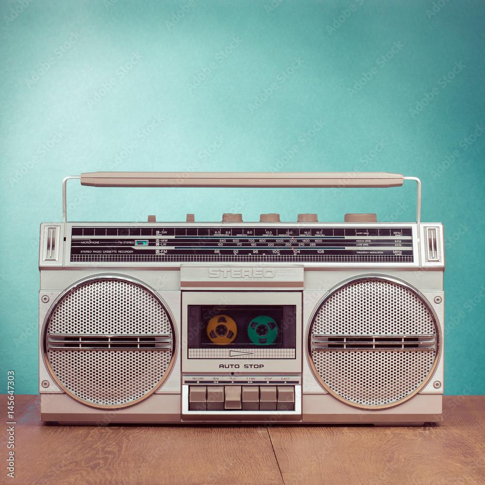 1000x1000 Retro ghetto blaster cassette tape recorder on table in front mint green background