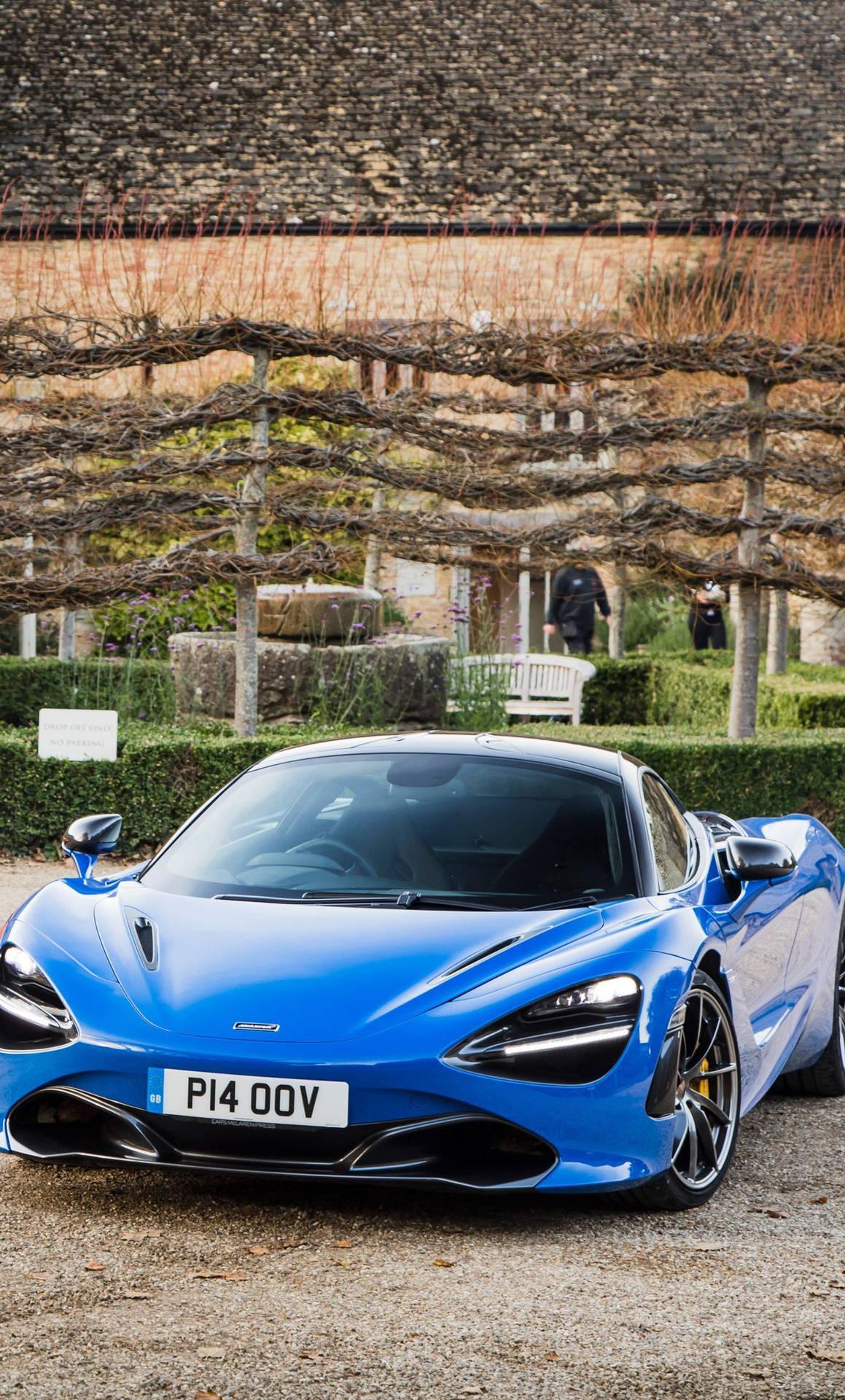 1159x1920 Download Mclaren 720s Blue Car In Garden Phone Wallpaper